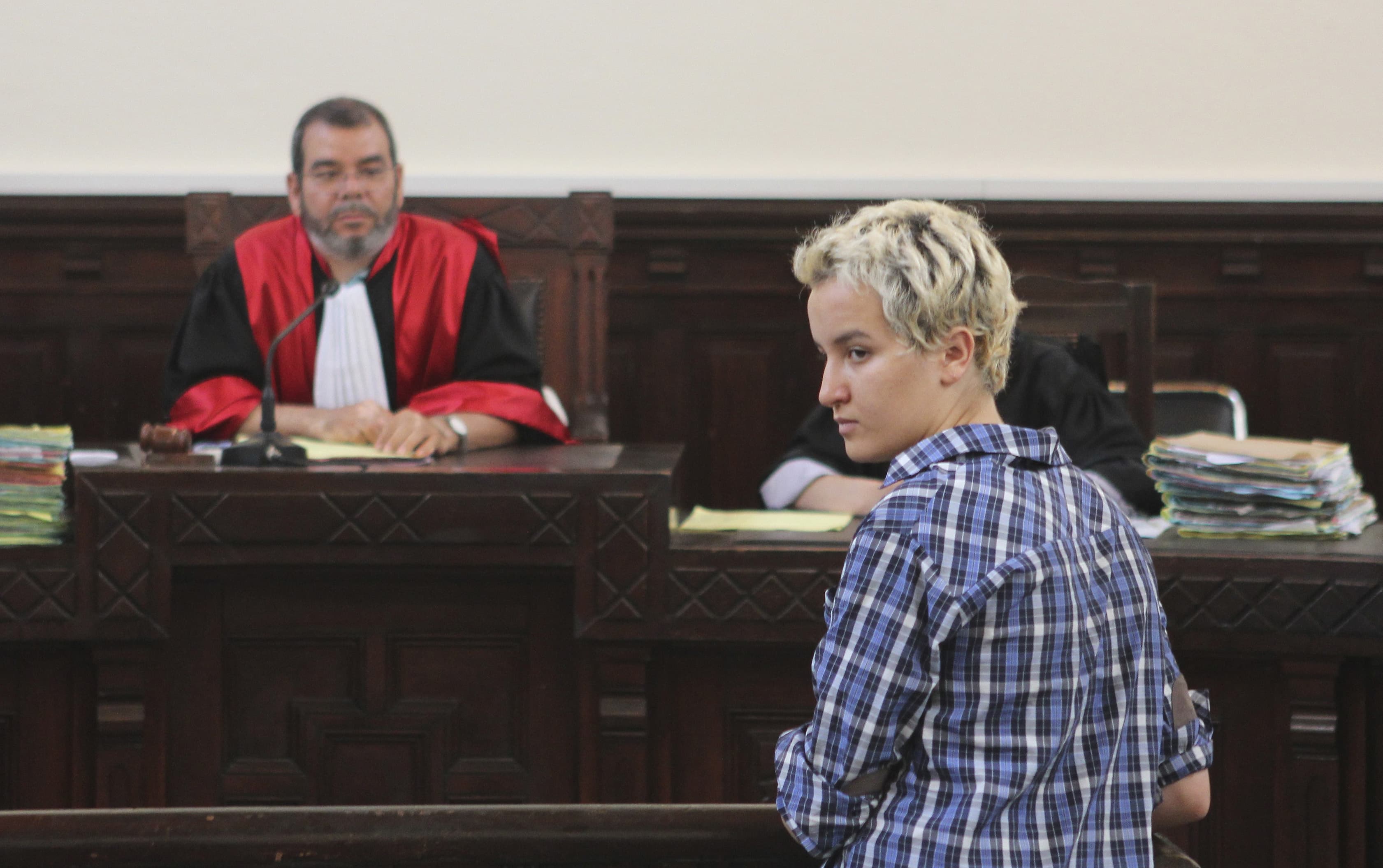 Amina Sboui (R), the Tunisian member of the Ukrainian feminist group Femen, appears in a courtroom in Sousse on 4 July 2013, REUTERS/Med Amine Benaziza