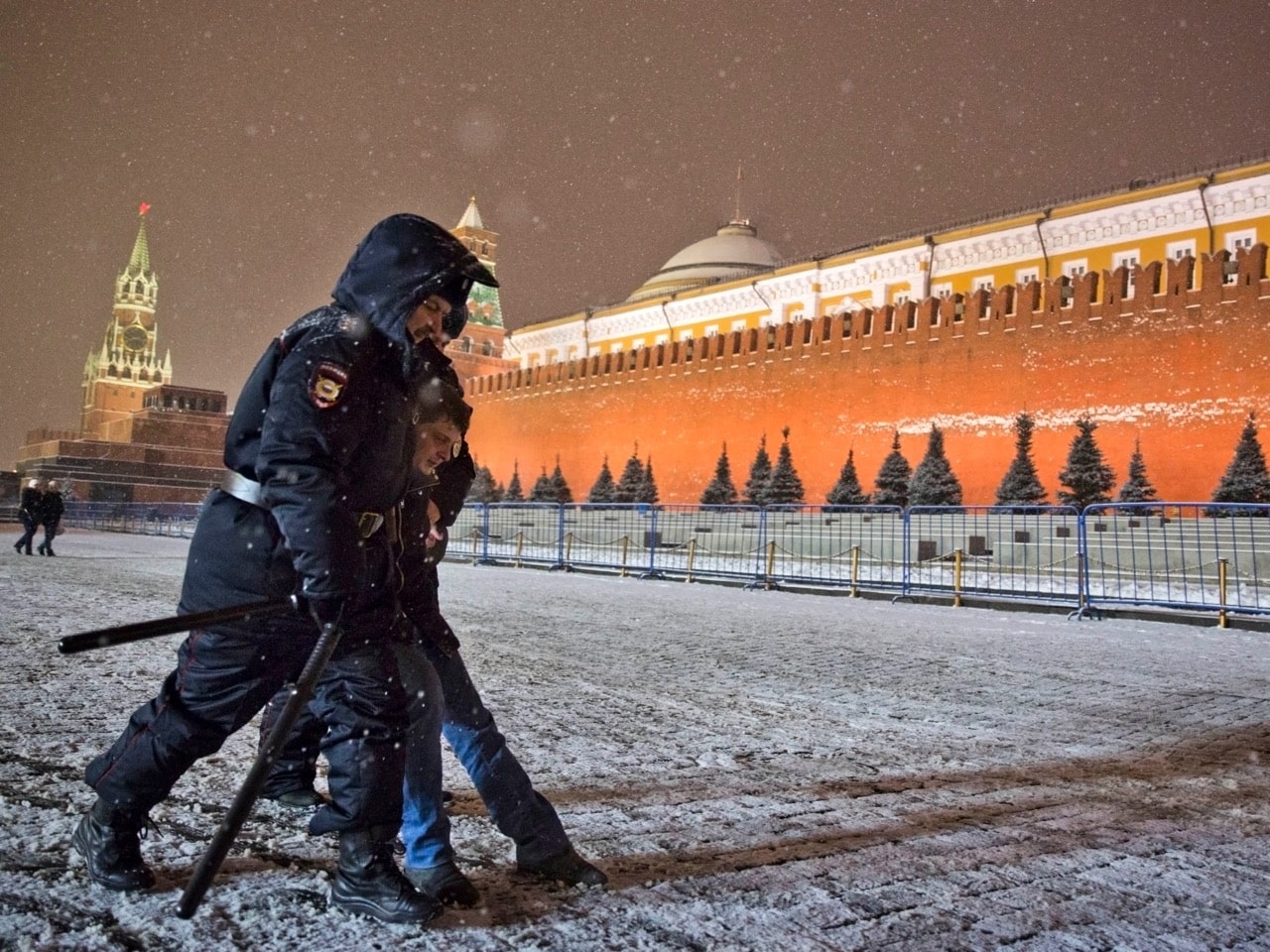 Police detain an LGBTQI+ activist in Red Square in Moscow, 7 February 2014, AP Photo/Evgeny Feldman