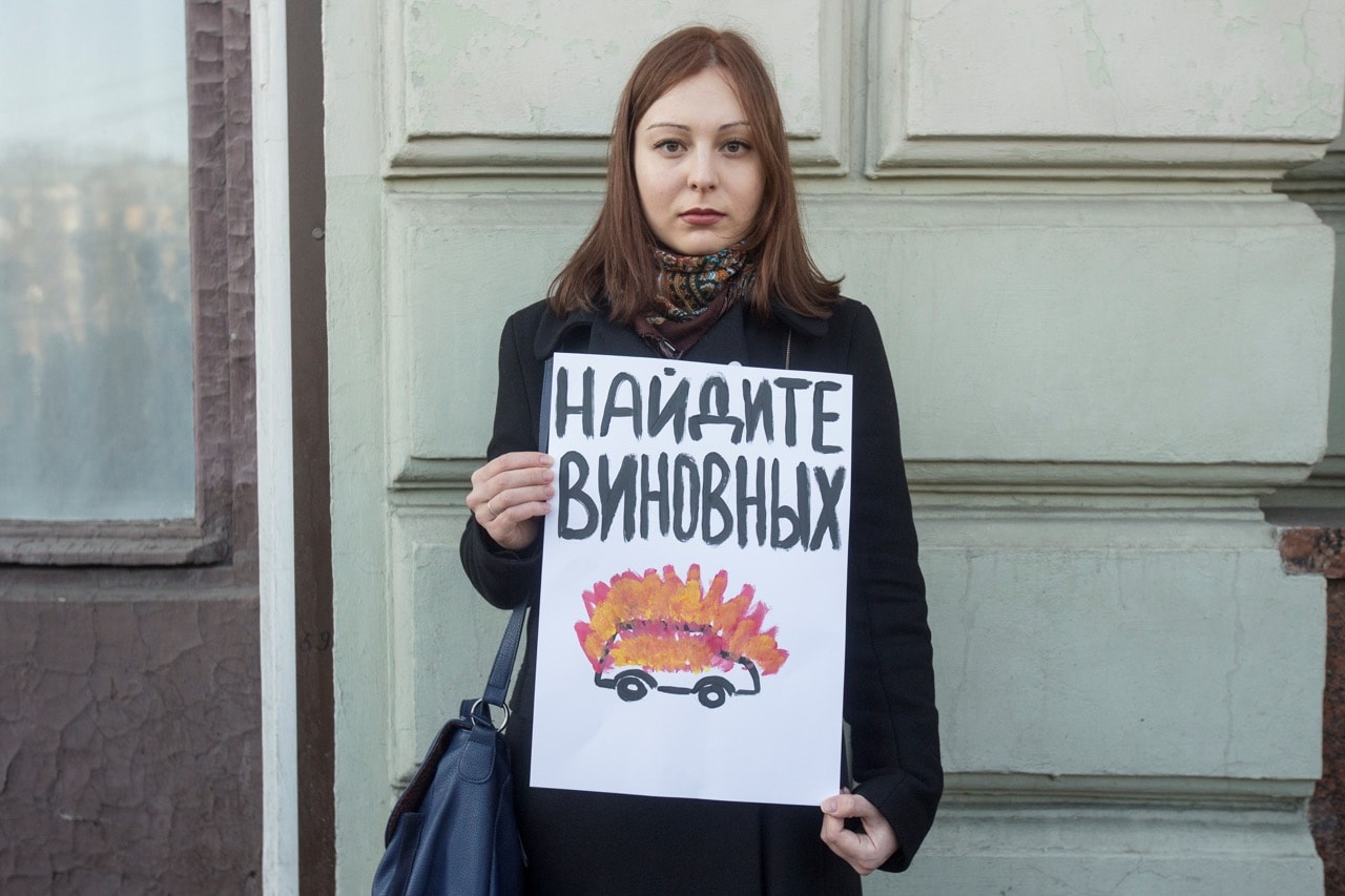 A woman holds a poster condemning the Ingushetia attack on journalists and human rights defenders, during a protest in Moscow, Russia, 10 March 2016, Nikita Shvetsov/Anadolu Agency/Getty Images