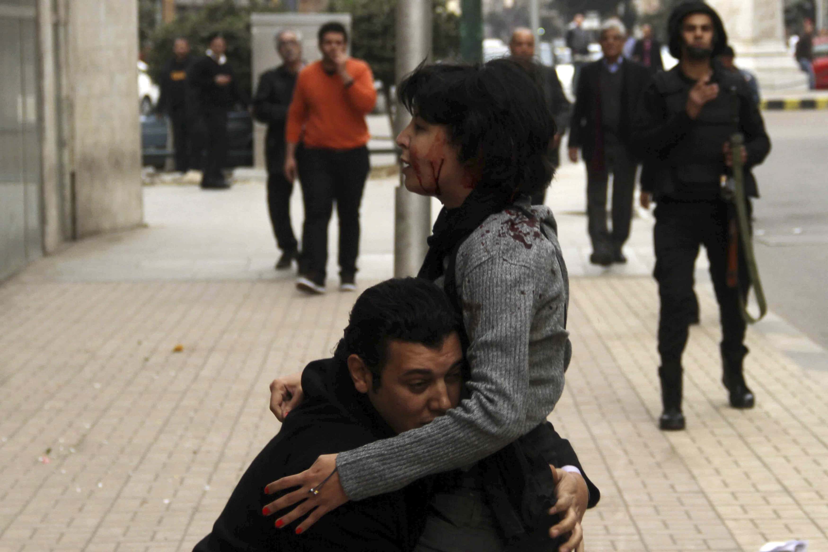 Activist Shaimaa al-Sabbagh receives help after she was shot dead during a protest in Cairo January 24, 2015, REUTERS/Al Youm Al Saabi Newspaper