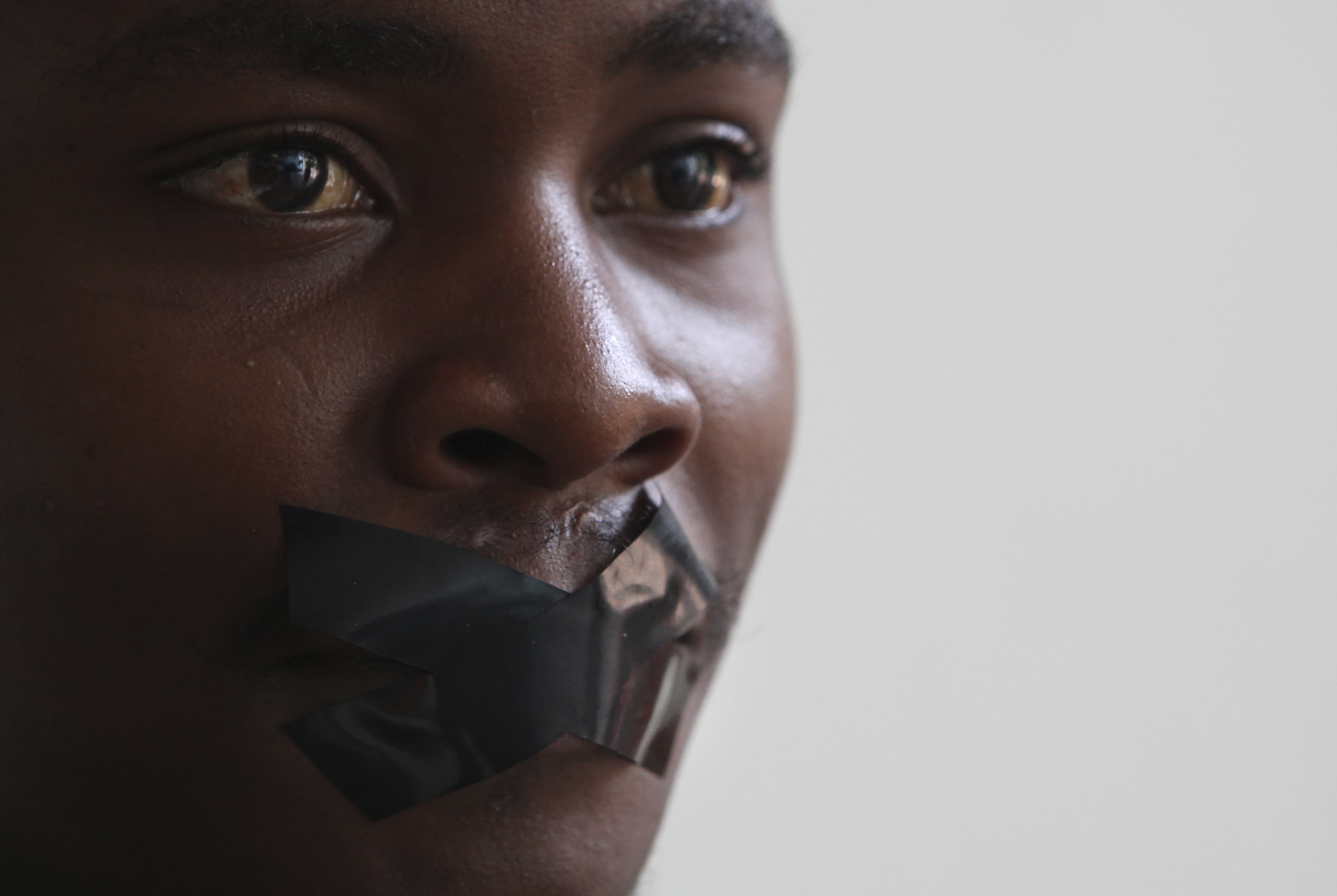 A South African journalist takes part in a 26 February 2014 protest in Johannesburg against the arrest of an Al Jazeera crew in Egypt, AP Photo/Denis Farrell