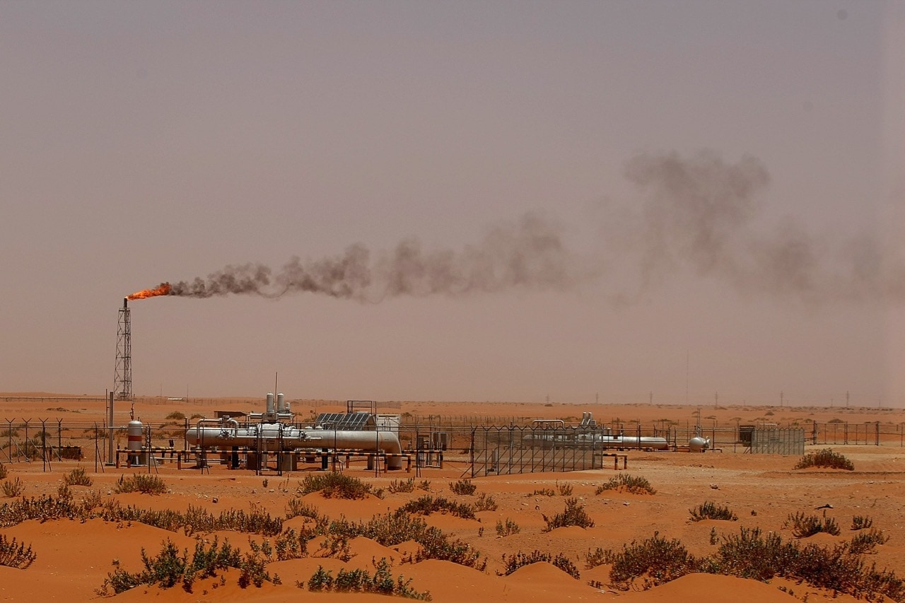 A flame from an Aramco oil installation is seen in the desert near Khouris, Saudi Arabia, 23 June 2008; economist Essam Al Zamil had opposed the sale of the Saudi company, MARWAN NAAMANI/AFP/Getty Images