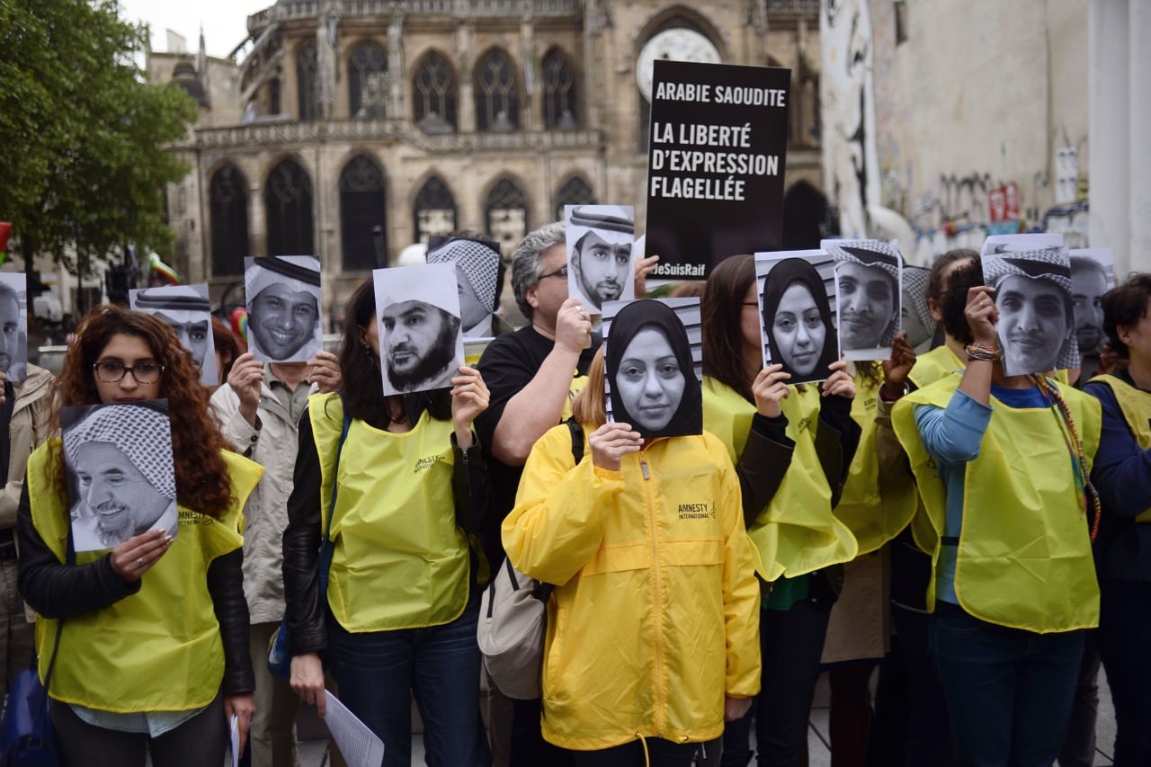 People demonstrate in support of blogger Raif Badawi and others detained in Saudi Arabia, during an event in Paris, France, 7 May 2015, STEPHANE DE SAKUTIN/AFP/Getty Images