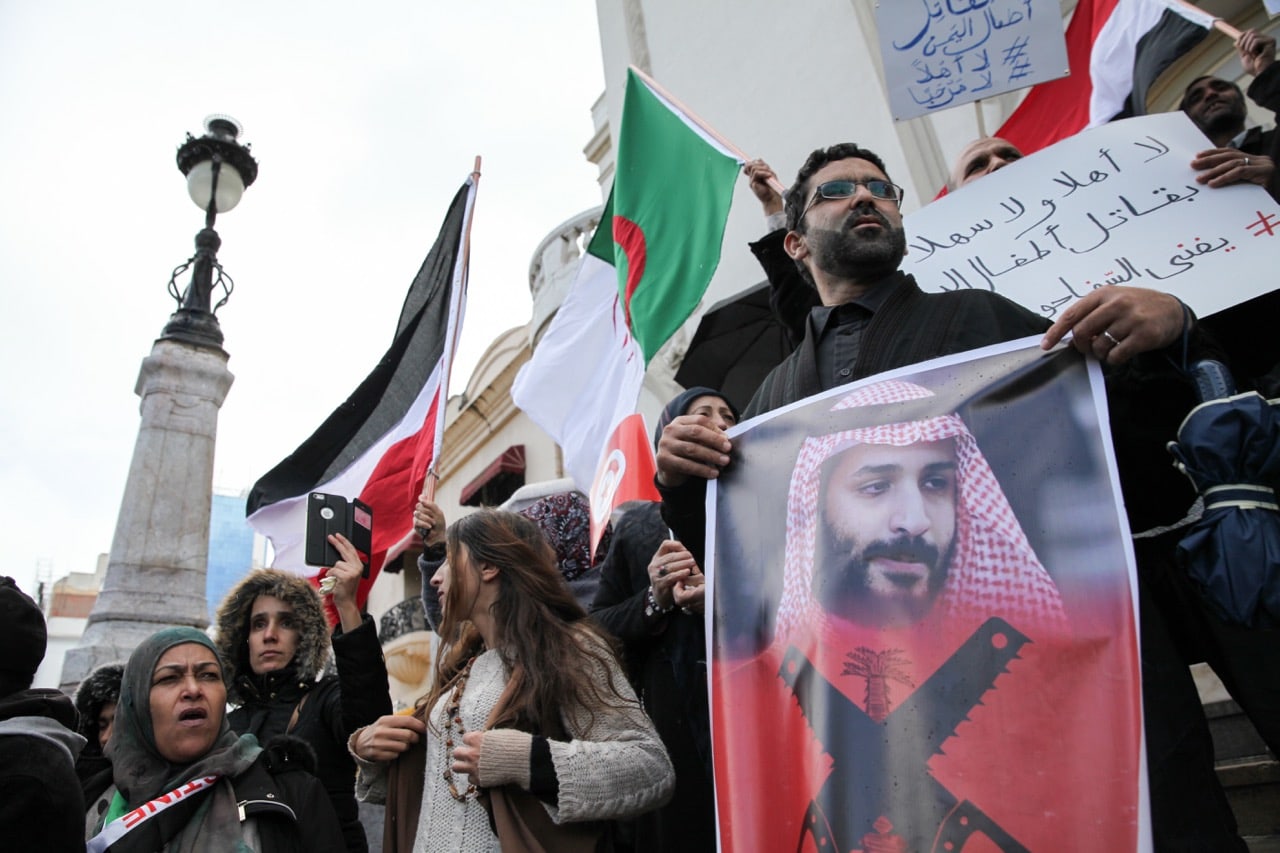 A protester holds a portrait of Mohammed bin Salman during a demonstration against the Saudi Crown Prince's visit to Tunisia, in Tunis, 27 November 2018, Chedly Ben Ibrahim/NurPhoto via Getty Images