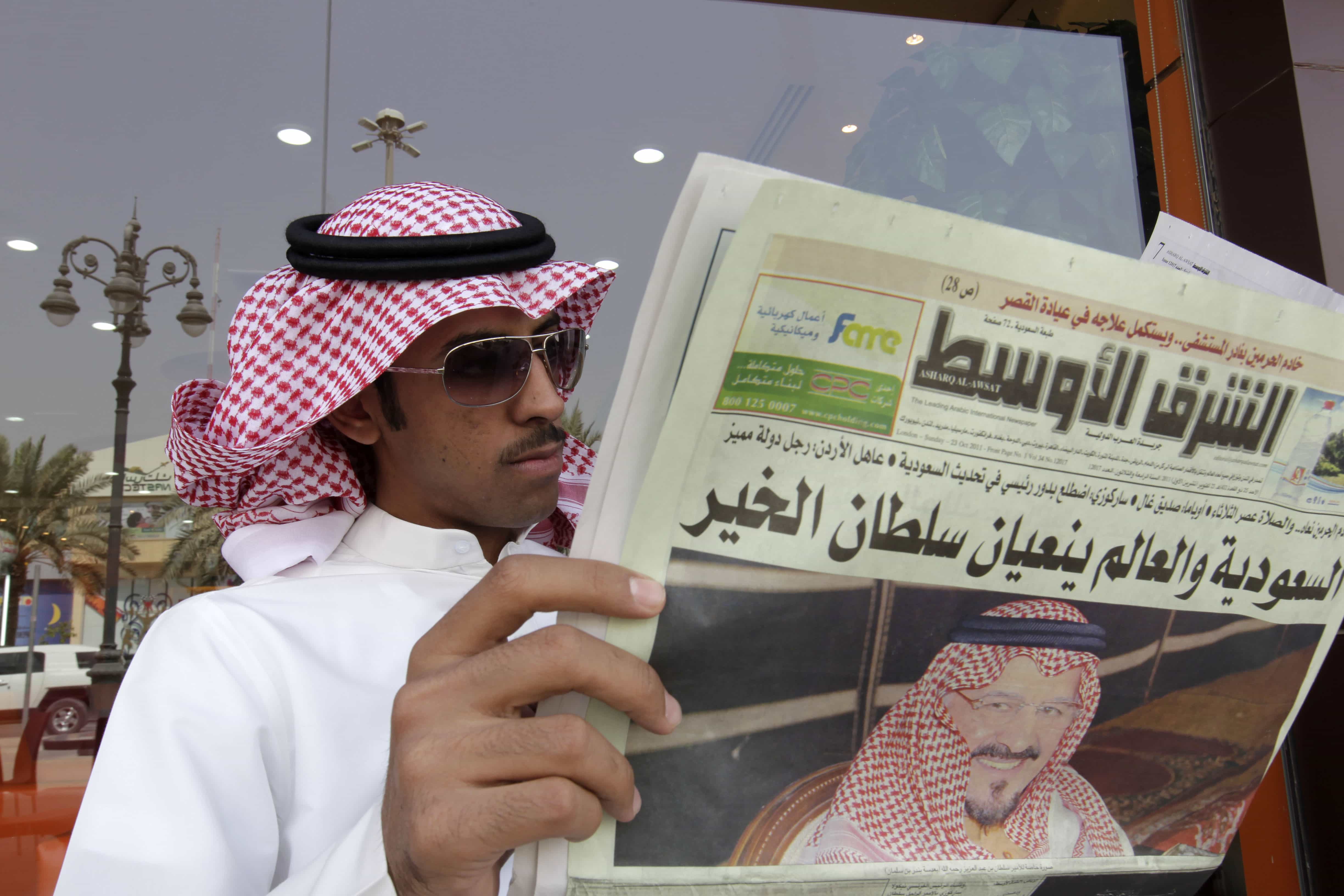 a Saudi man reads Asharq al-Awsat newspaper, in Riyadh, Saudi Arabia, AP Photo/Hassan Ammar, File