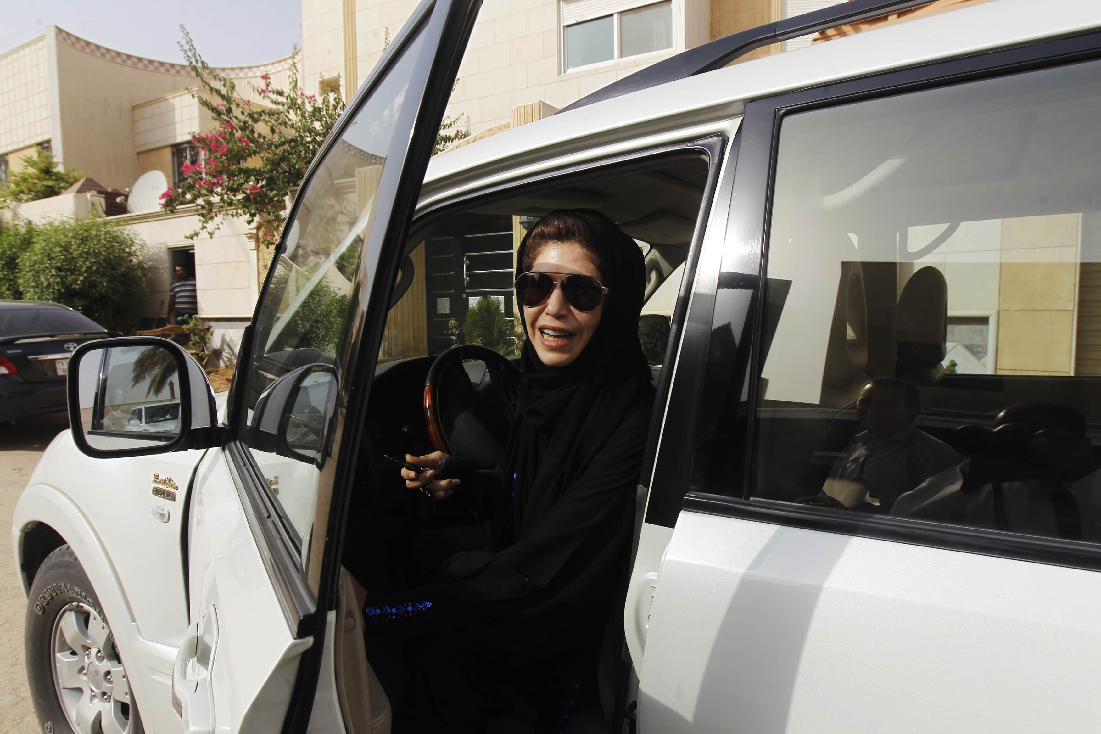 Female driver Azza Al Shmasani alights from her car after driving in defiance of the ban in Riyadh on 22 June 2011, REUTERS/Fahad Shadeed