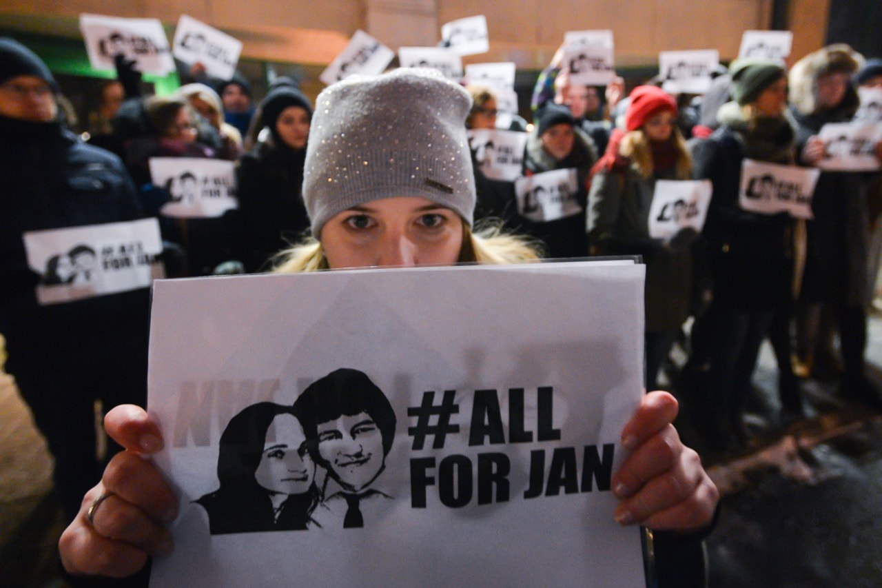 People hold a candle-lit vigil in front of the Consulate General of the Slovak Republic in Krakow, Poland, in memory of the journalist Ján Kuciak and his partner Martina Kušnírová, 2 March 2018, Artur Widak/NurPhoto via Getty Images