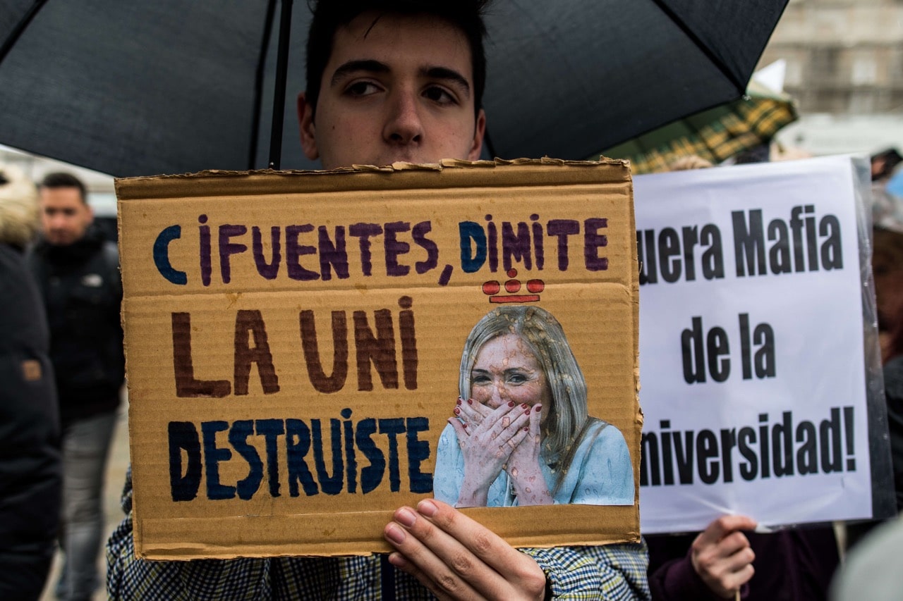 Students of Rey Juan Carlos University call for the resignation of Cristina Cifuentes and for the rector of the university, Javier Ramos, in Madrid, Spain, 12 April 2018, Marcos del Mazo/LightRocket via Getty Images