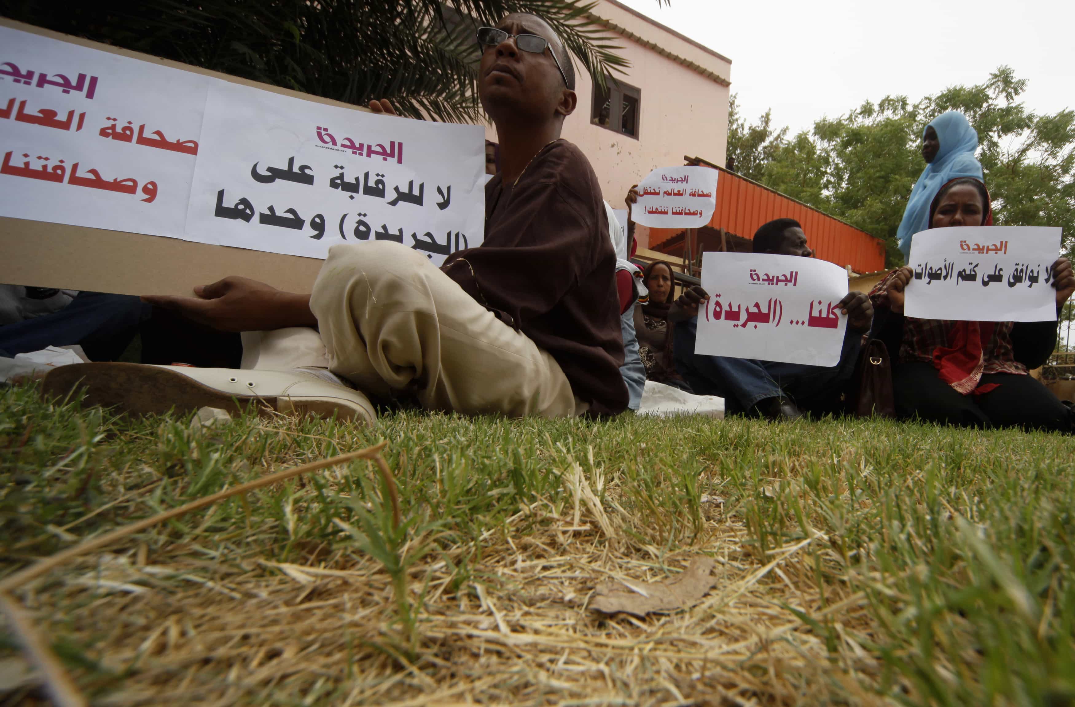 Journalists demonstrate against the closure of their Al-Jareeda newspaper on World Press Freedom Day in Khartoum, May 3, 2012. Recent issues of Al-Jareeda were seized by Sudanese authorities on 19 September 2013., Reuters/Mohamed Nureldin Abdallah