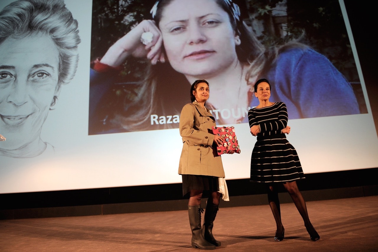 Maha Assabalani, a representative of the Violation Documentation Center, accepts an award on Razan Zeitouneh's behalf, during the 'Francoise Giroud' Award Ceremony in Paris, France, 30 January 2014, Kristy Sparow/Getty Images
