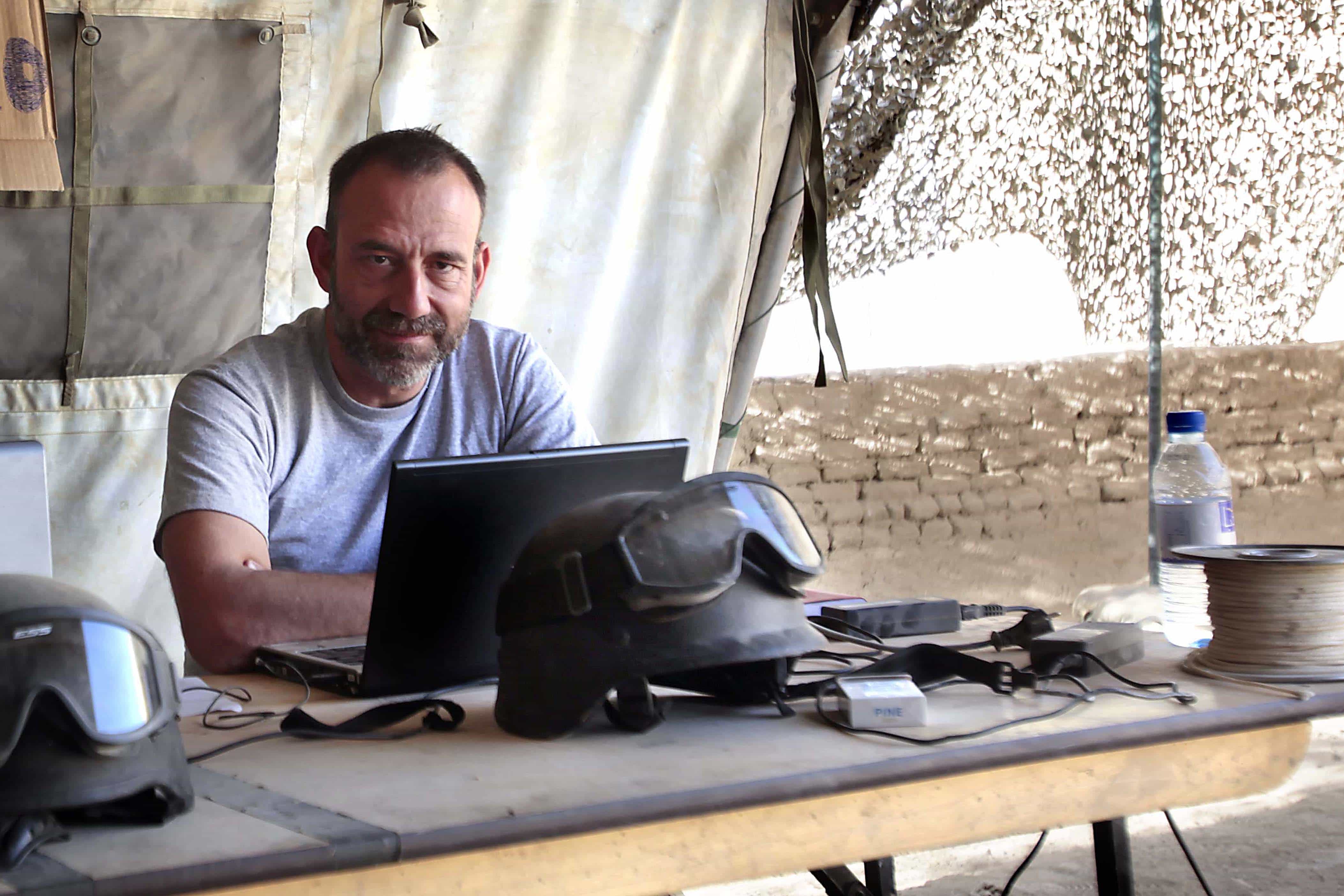 Journalist Marc Marginedas  sits by his laptop at the Canadian base in Nakhonay, Afghanistan in this photo taken on 10 October 2010., AP Photo/Agustin Catalan, El Periodico de Catalunya