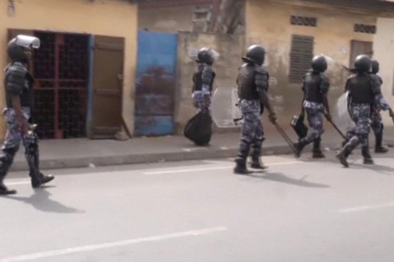 A still image taken from a video shows policemen patrolling a street during a protest in Lomé, Togo, 18 October 2017, REUTERS/via Reuters TV