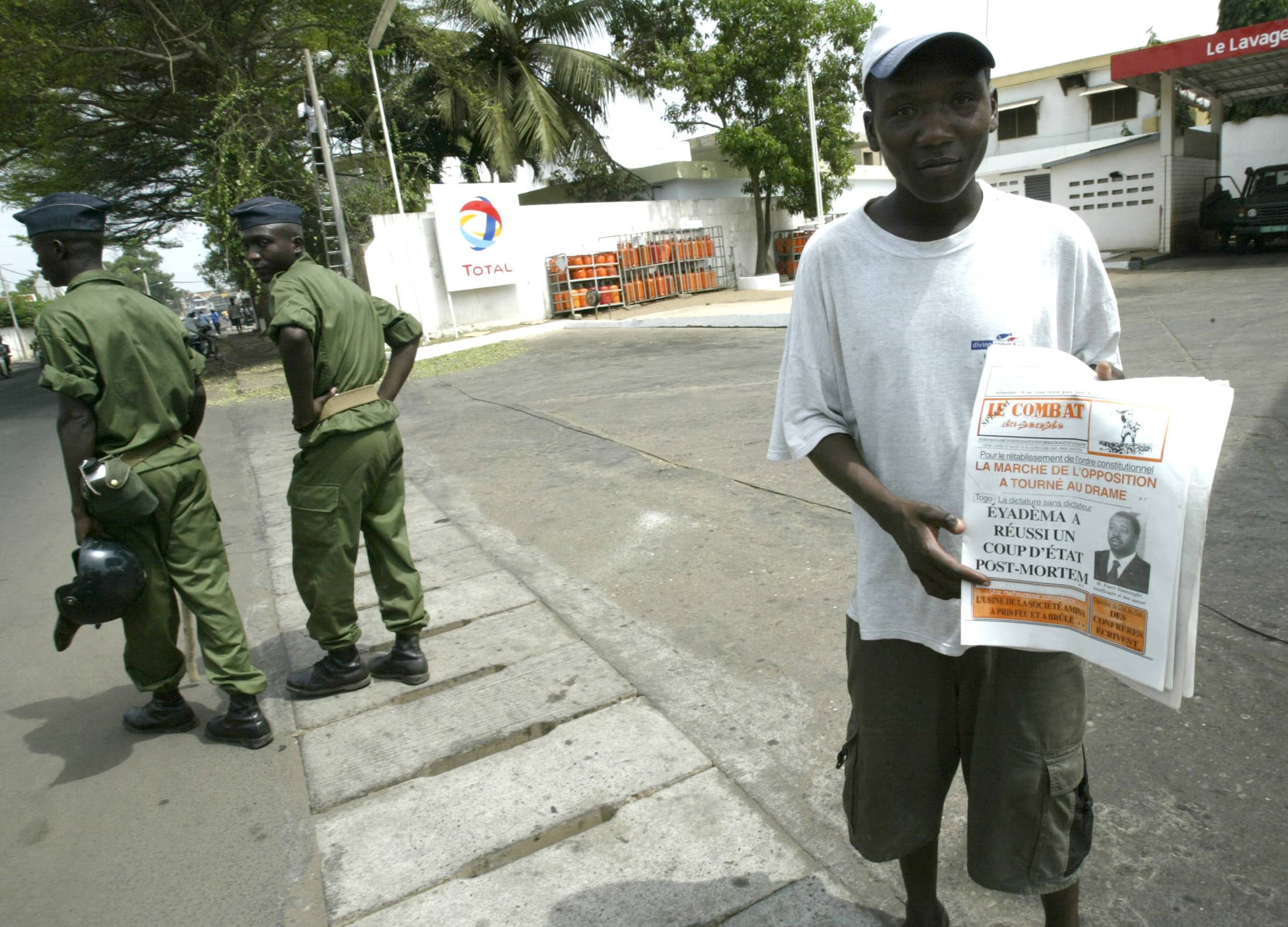 A young Togolese man sells newspapers in the suburb of Be in Lomé, 14 February 2005, REUTERS/Luc Gnago LG/ACM