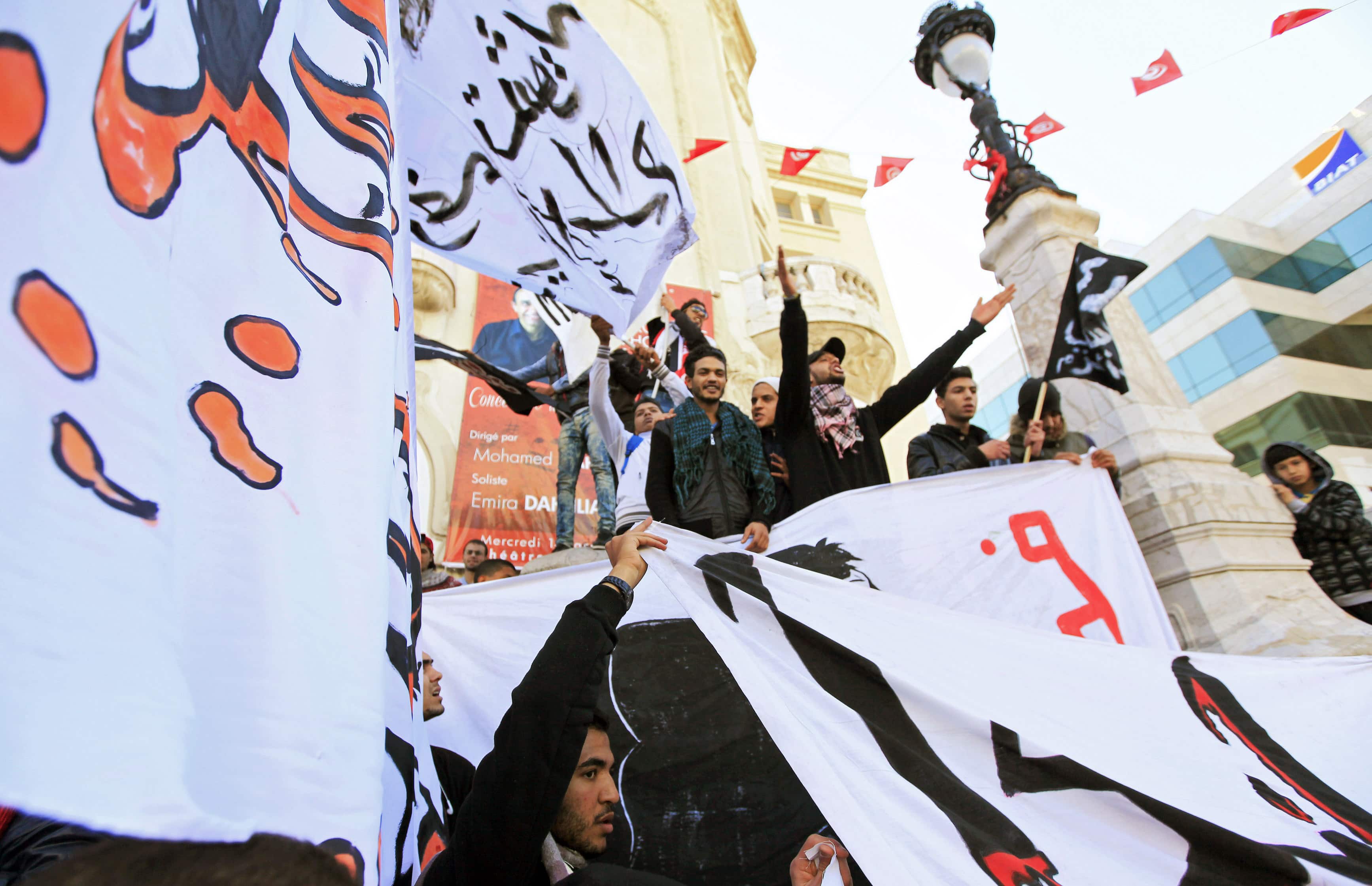 Tunisian protesters shout slogans against French newspaper "Charlie Hebdo" and their new front cover during a rally in Tunis, 14 January 2015, REUTERS/Anis Mili