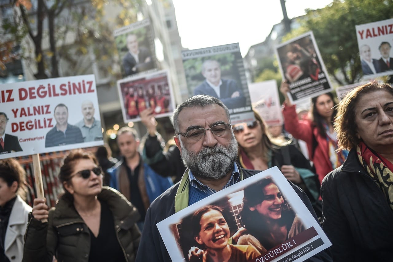 People take part in a protest against the Turkish government for arresting journalists, academics and lawyers in Istanbul, 2 December 2017, OZAN KOSE/AFP/Getty Images