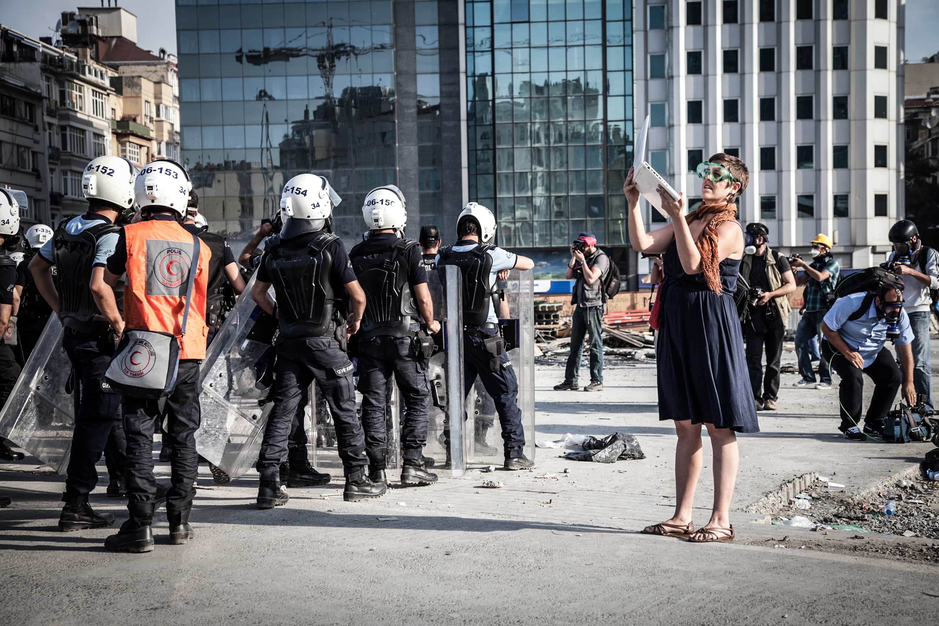 A journalist documents police as they came to retake Istanbul's Taksim Square on 11 June 2013., Rex Features via AP Images