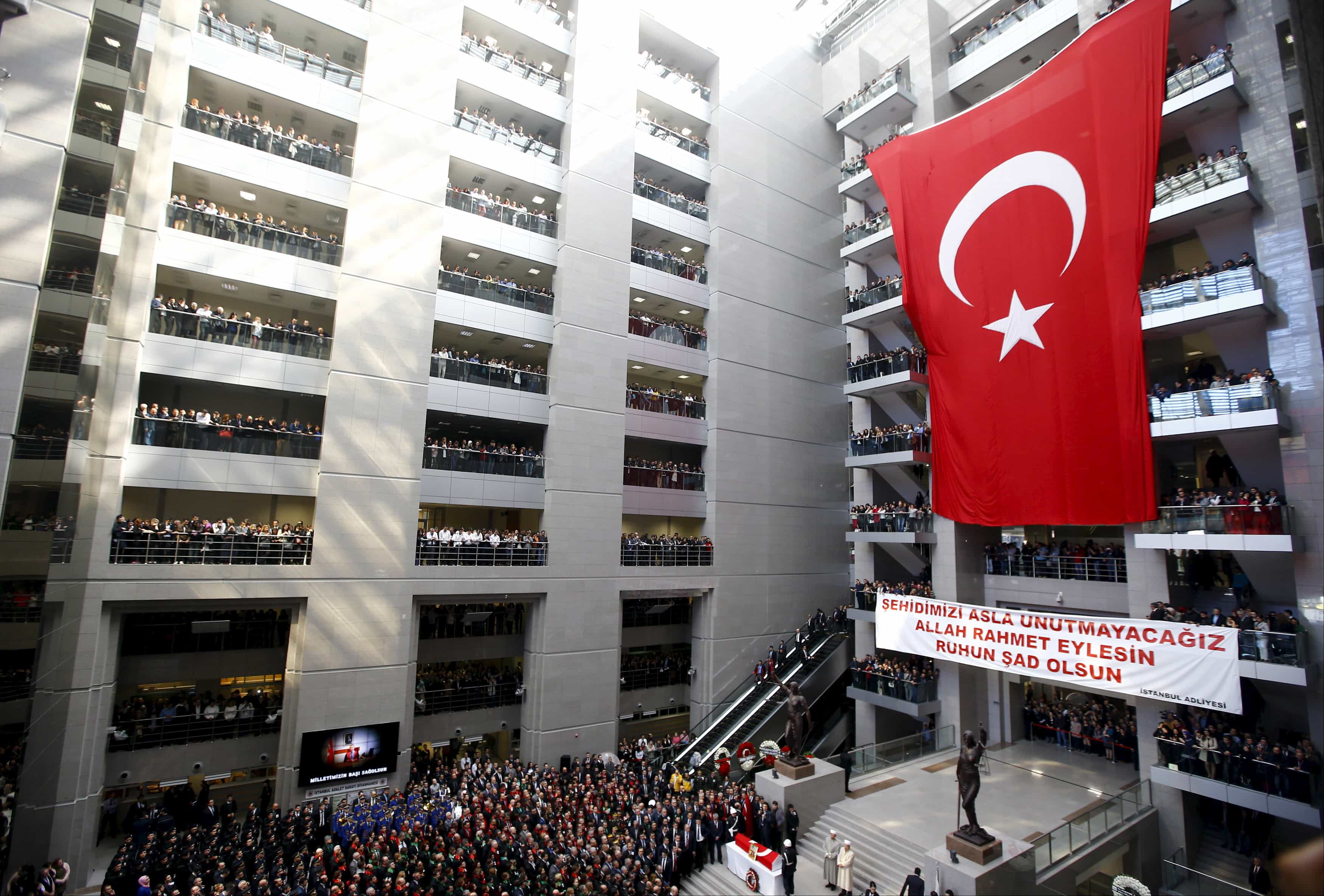 People attend the funeral ceremony of prosecutor Mehmet Selim Kiraz at the Justice Palace in Istanbul, 1 April 2015, REUTERS/Osman Orsal