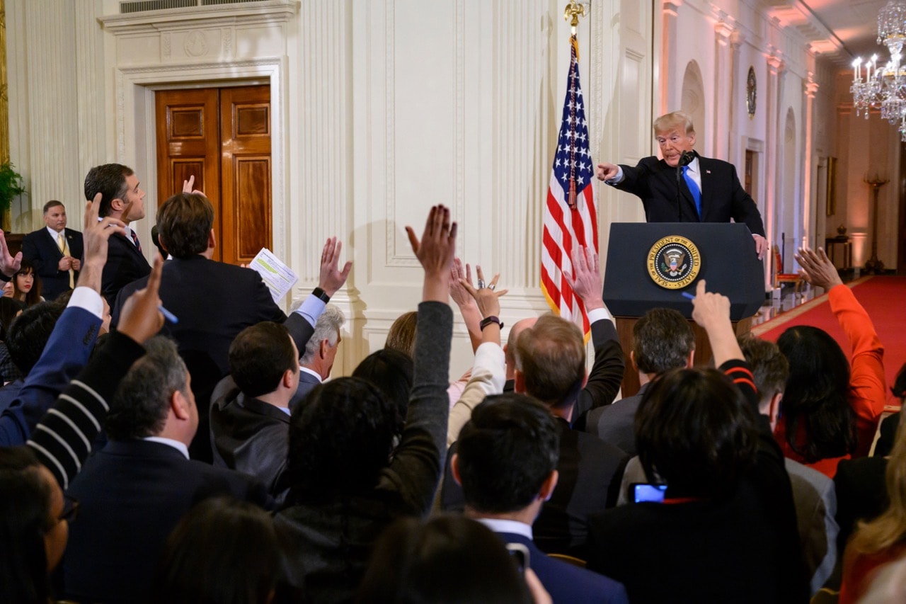 President Donald Trump points at reporters who raise their hands to ask questions during a press conference in the White House in Washington, D.C., 7 November 2018, Calla Kessler/The Washington Post via Getty Images