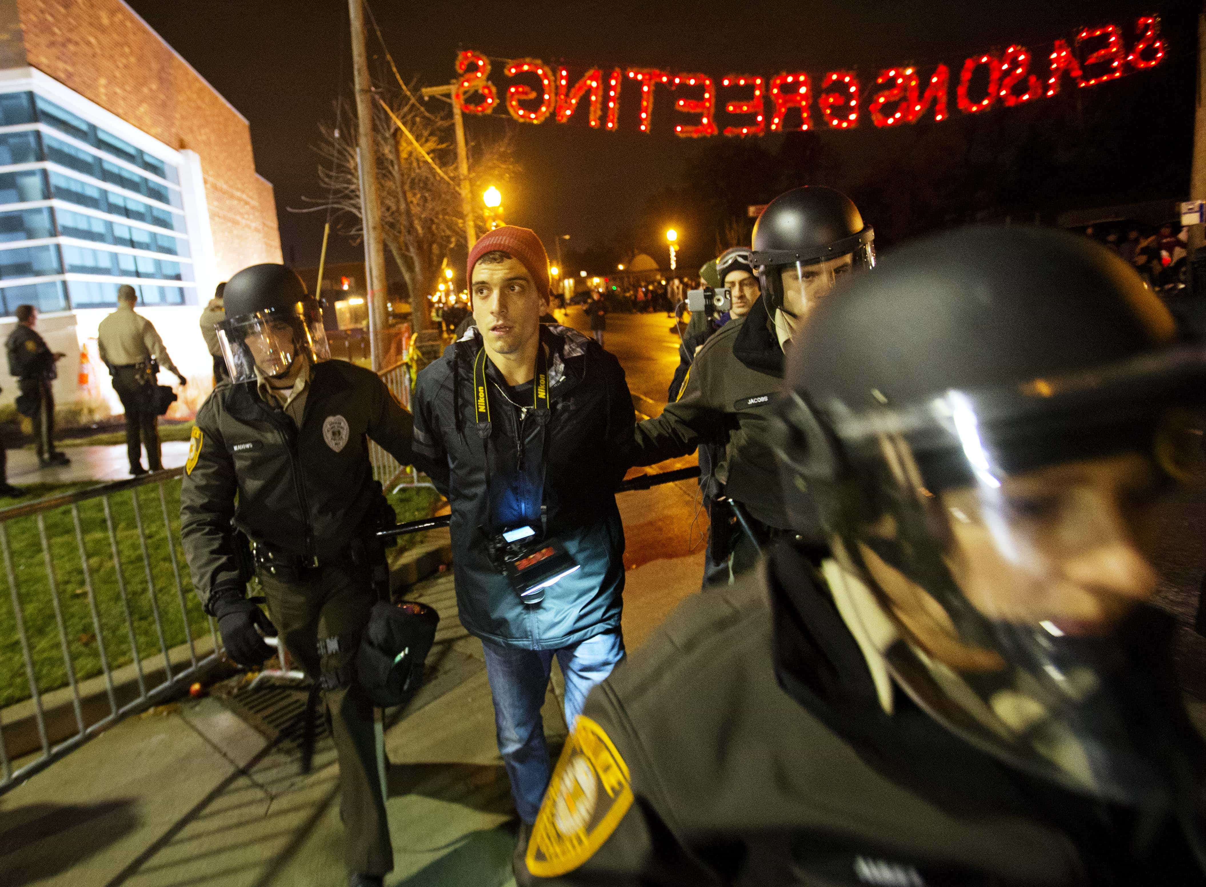Journalist Trey Yingst is arrested during a demonstration outside the Ferguson Police Department, 23 November 2014, AP Photo/David Goldman