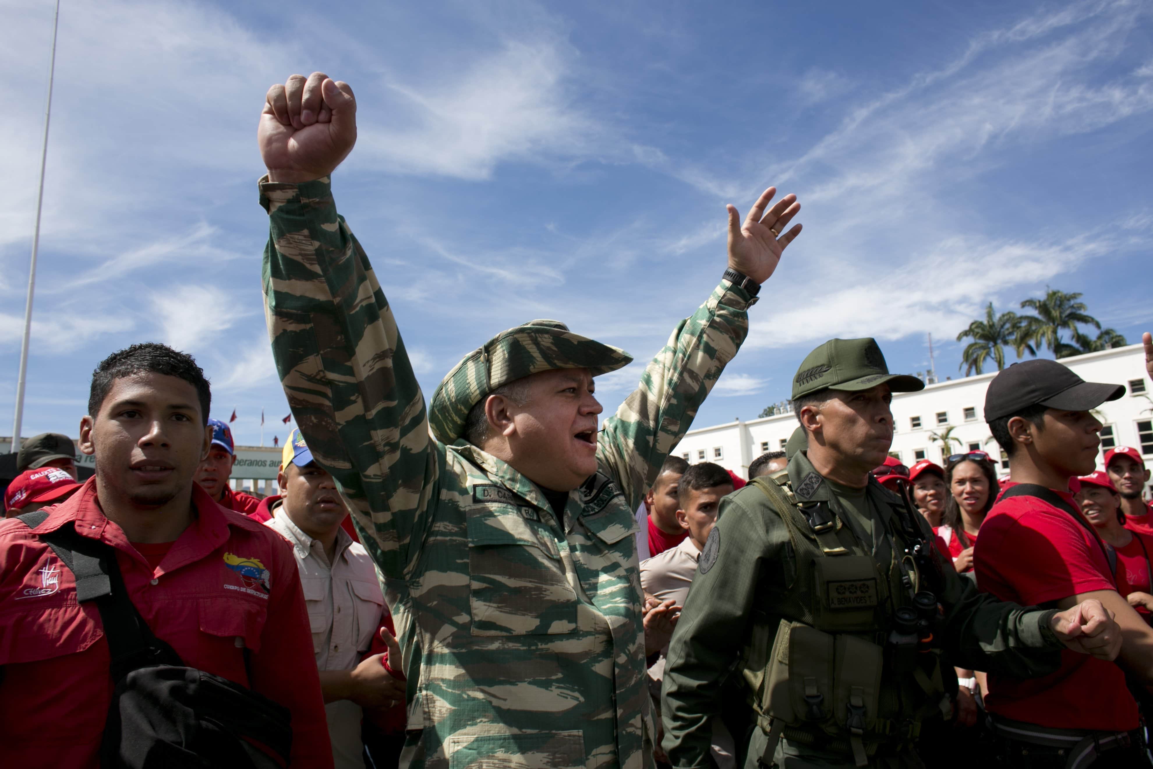 Pro-government politician Diosdado Cabello, center, gestures to supporters during a civic military parade in Caracas, Venezuela, 14 January 2017, AP Photo/Ariana Cubillos