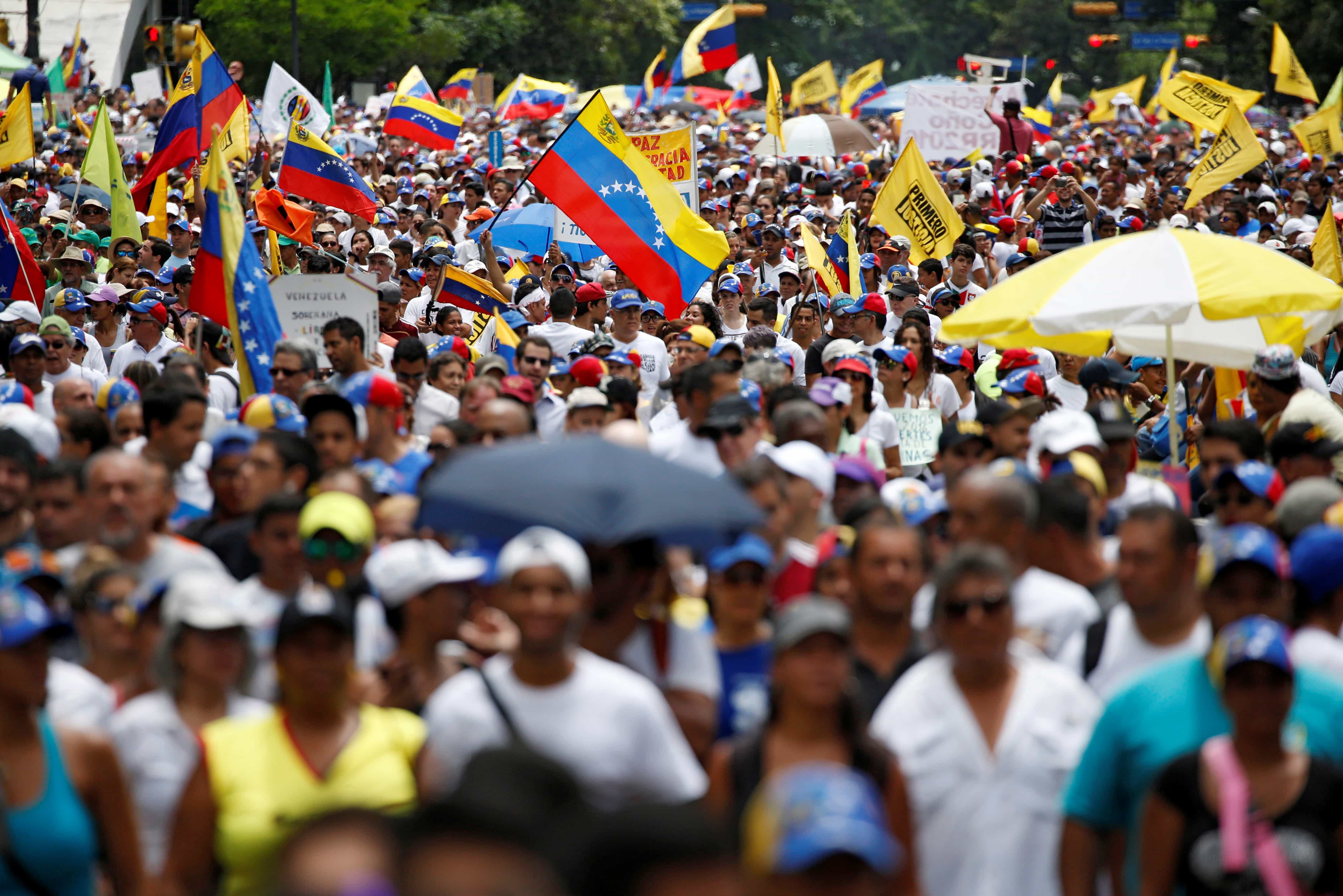 Opposition supporters take part in a rally to demand a referendum to remove Venezuela's President Nicolas Maduro, in Caracas, 1 September 2016, REUTERS/Carlos Garcia Rawlins