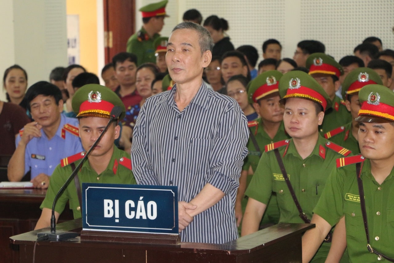 Blogger Le Dinh Luong listens to the court verdict in Nghe An province, Vietnam, 16 August 2018, VIETNAM NEWS AGENCY/AFP/Getty Images