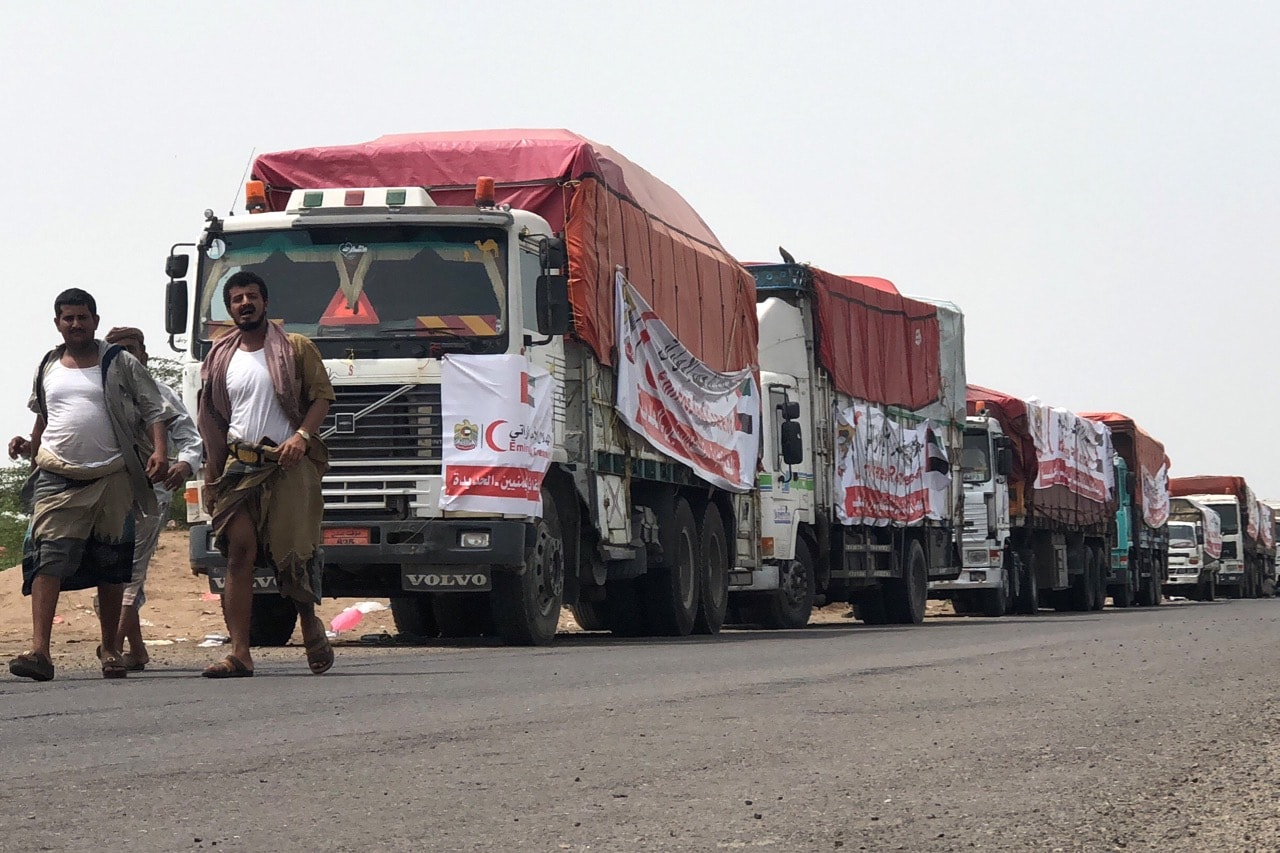 A humanitarian convoy of the UAE Red Crescent arrives in Mokha, Hodeida province, Yemen, 22 June 2018, STRINGER/AFP/Getty Images