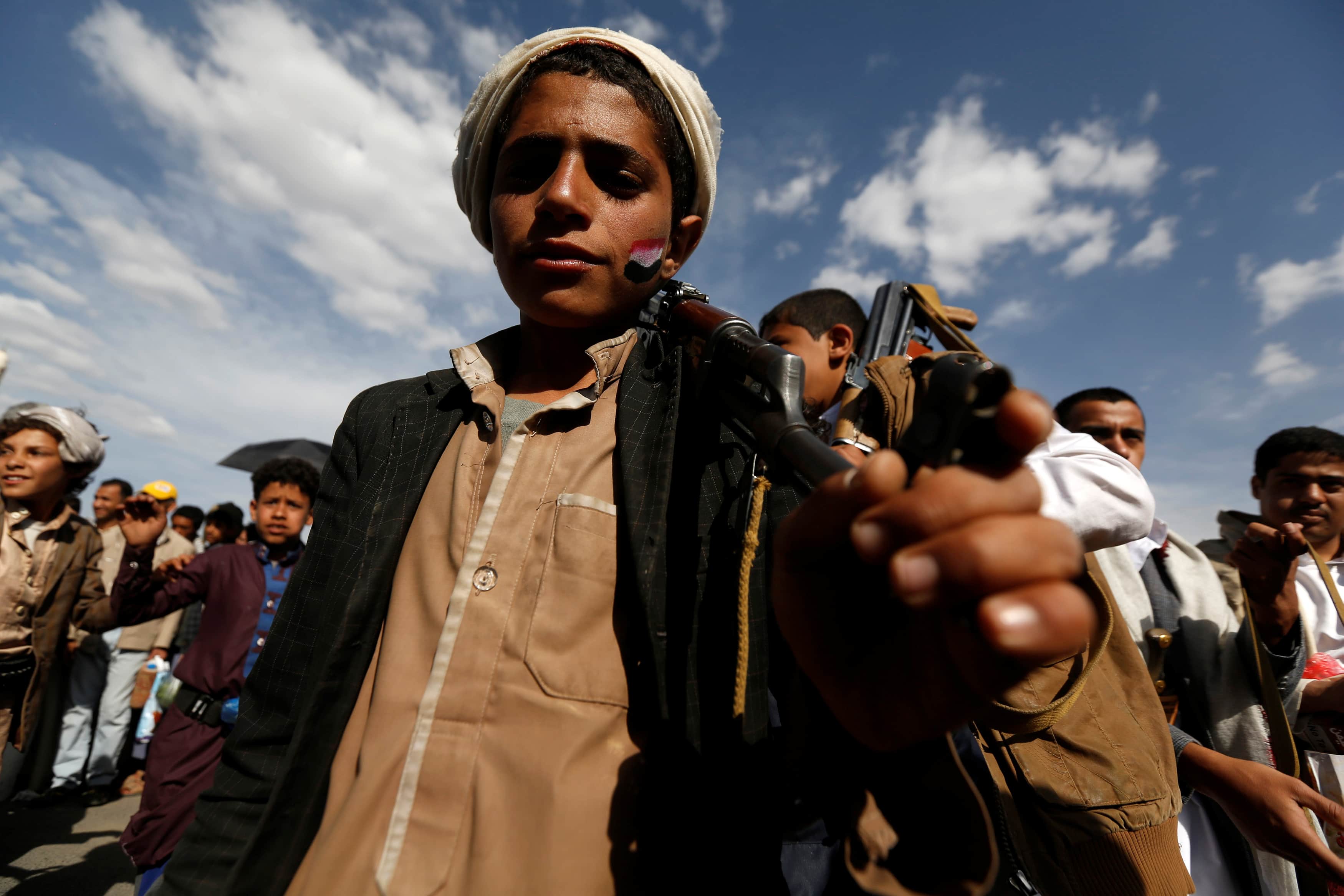 On 20 May 2017, a young Houthi follower carries a rifle as he demonstrates in Sanaa, Yemen, against the USA during a visit to neighbouring Saudi Arabia by U.S. President Donald Trump, REUTERS/Khaled Abdullah