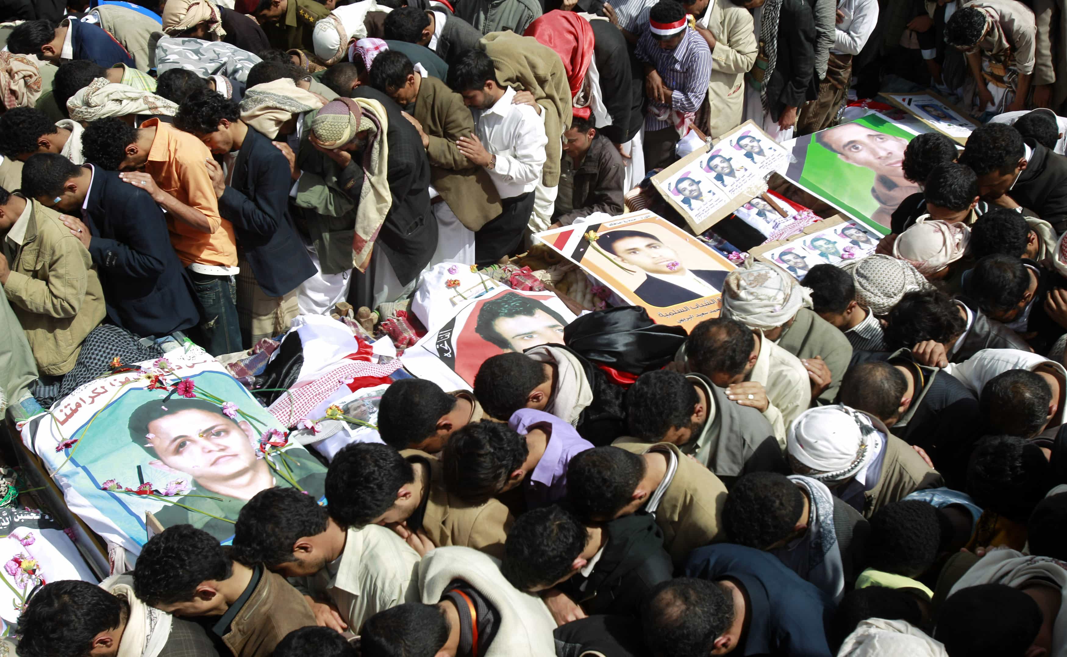 Mourners pray during the March 20, 2011 funeral of anti-government protesters killed in the Friday of Dignity massacre in Yemen, REUTERS/Khaled Abdullah