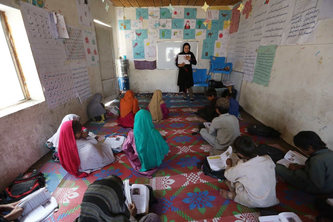 Afghan internally displaced school girls study in a class near their temporary home in Kabul, Afghanistan, 31 May 2016, AP Photo/Rahmat Gul