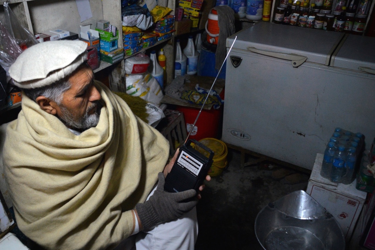 A man listens to Islamic State Radio at his shop in Jalalabad, Nangarhar province, Afghanistan, 10 January 2016, AP Photos/Mohammad Anwar Danishyar