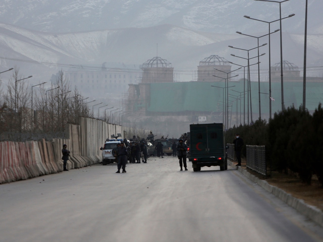 Afghan security forces inspect the site of two large bombings in Kabul, Afghanistan, 10 January 2017, AP Photo/Rahmat Gul