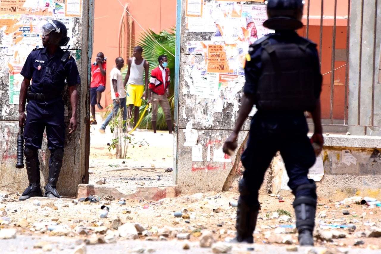 Senegalese police confront students during protests at the University Cheikh Anta Diop in Dakar, 16 May 2018, SEYLLOU/AFP/Getty Images