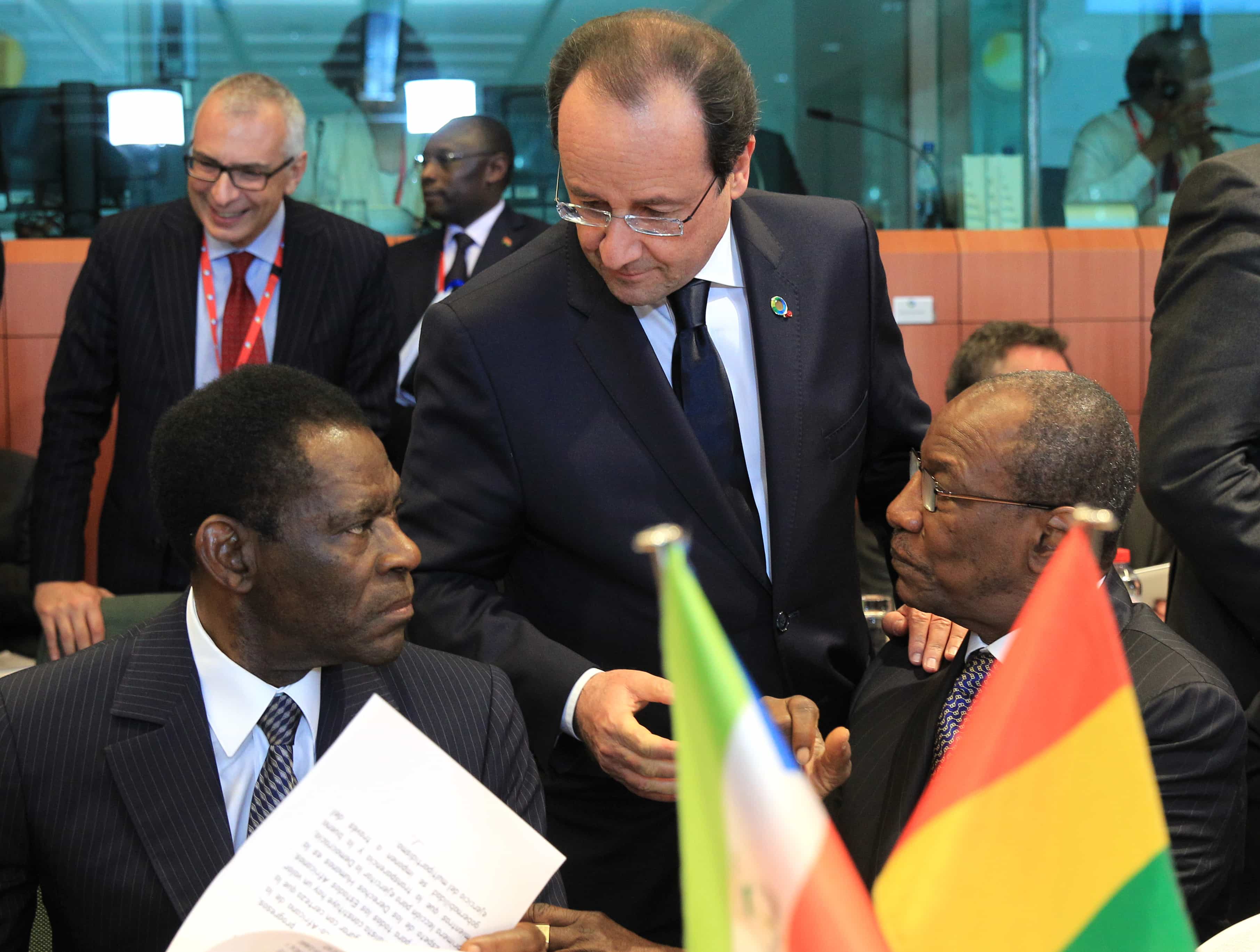 French President Francois Hollande talks with Equatorial Guinea President Teodoro Obiang Nguema Mbasogo and Guinea President Alpha Conde, 2 April 2014., AP Photo/Yves Logghe