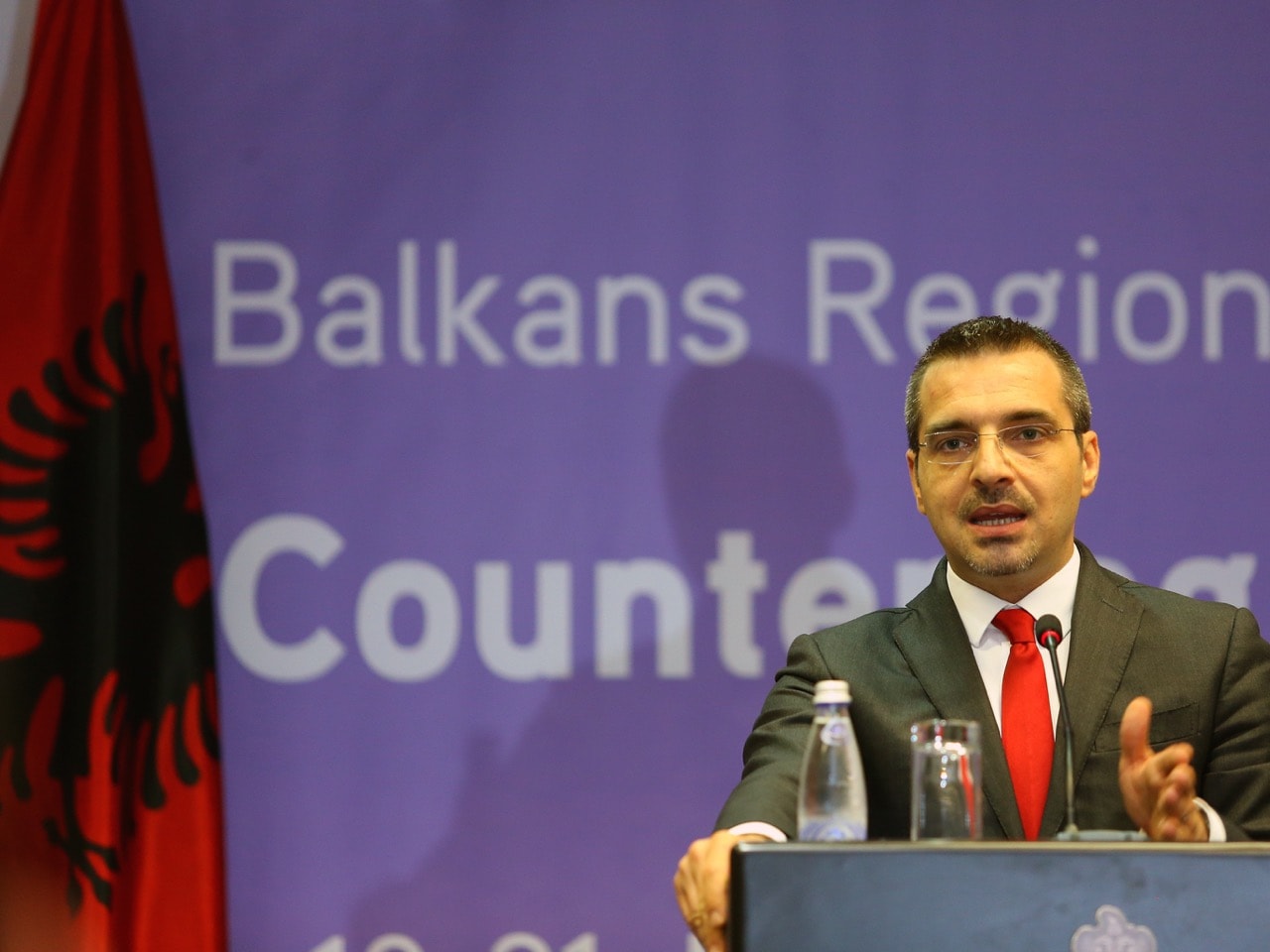 Interior Minister Saimir Tahiri - seen here at a 19 May 2015 news conference in Tirana - visited the assaulted journalist in hospital, AP Photo/Hektor Pustina