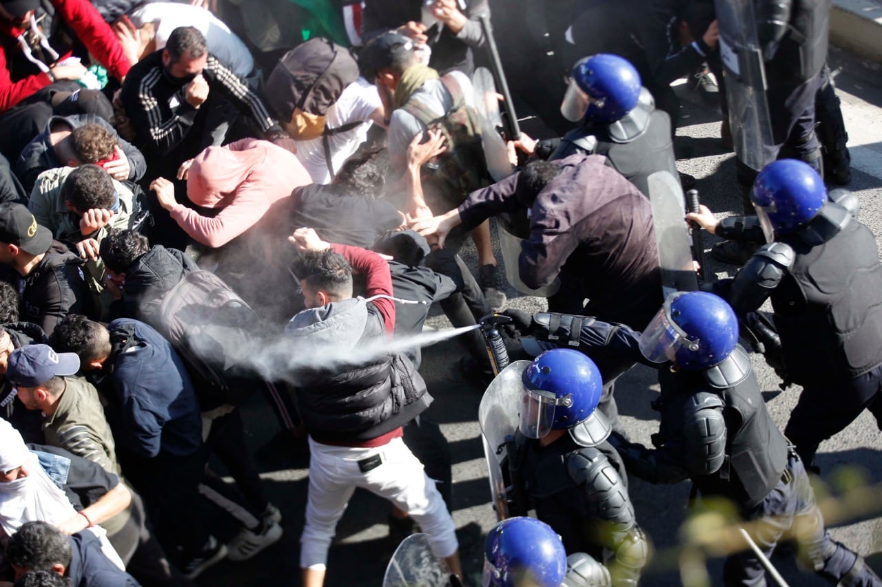 Algerians protesting against the fifth term of Abdelaziz Bouteflika are met by teargas fired by riot police in Algiers, Algeria, 1 March 2019, Billal Bensalem/NurPhoto via Getty Images