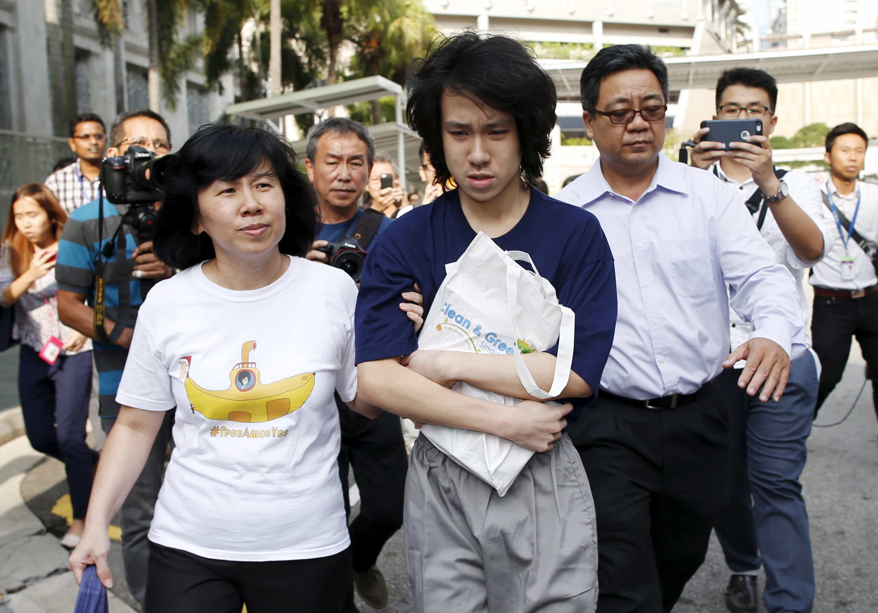 Teen blogger Amos Yee leaves with his parents after his sentencing from the State Court in Singapore on 6 July 2015, REUTERS/Edgar Su