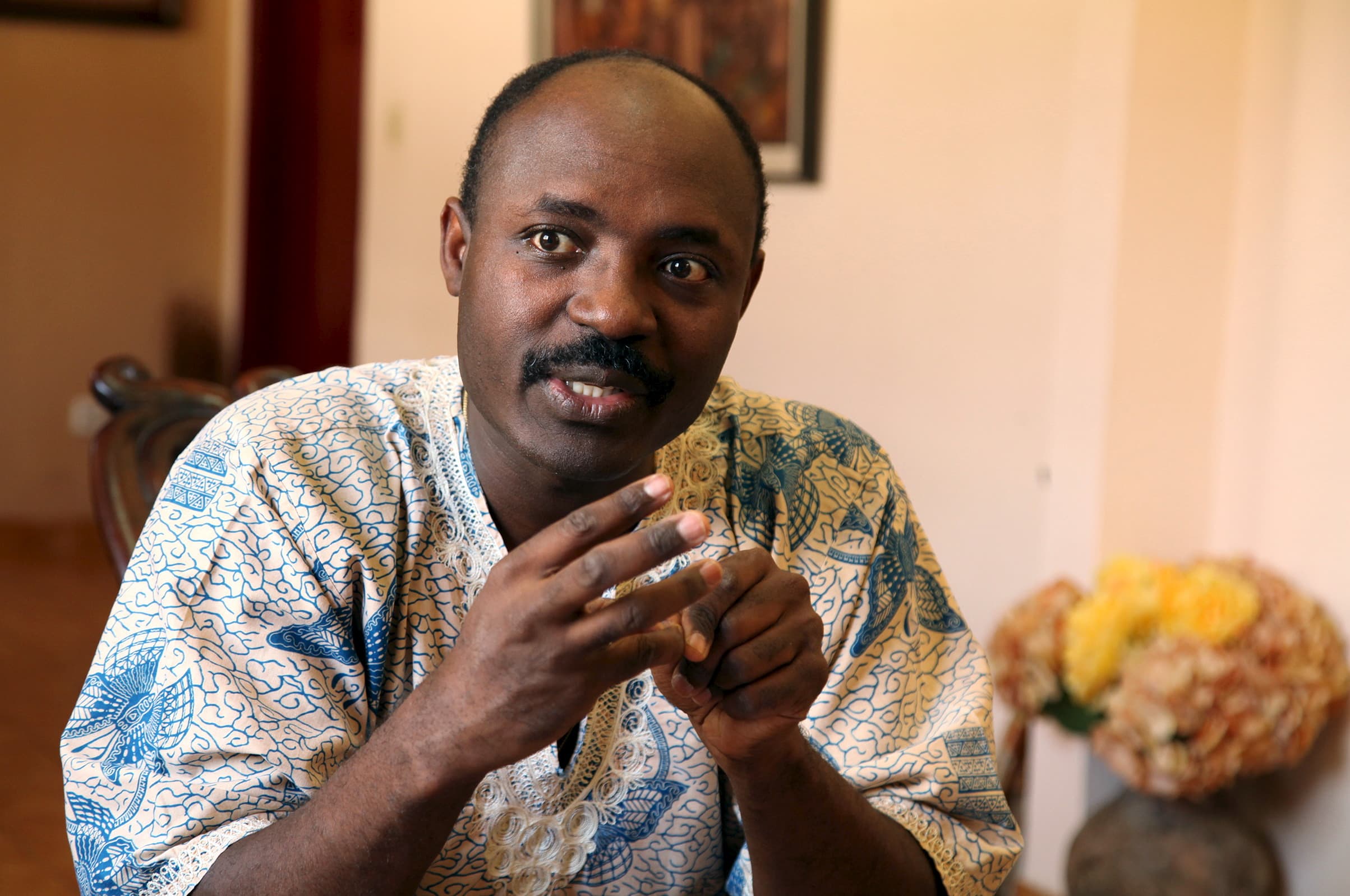 Rafael Marques de Morais gestures during an interview at his home in Luanda, 12 May 2015, REUTERS/Herculano Coroado
