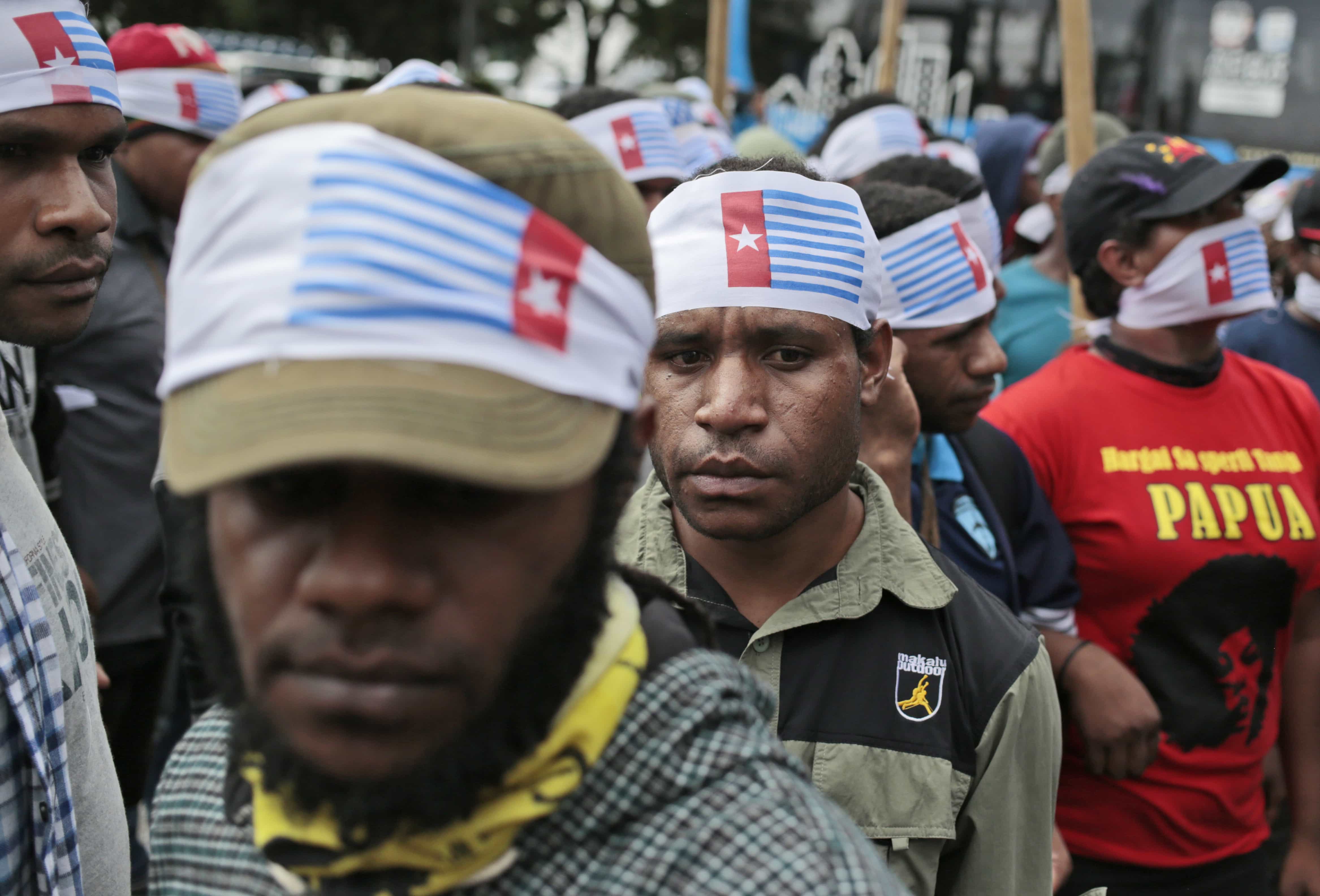 West Papuan protesters wear headbands with the banned "Morning Star" flag during a rally calling for the remote region's independence, in Jakarta, 1 December 2016, AP Photo/Dita Alangkara