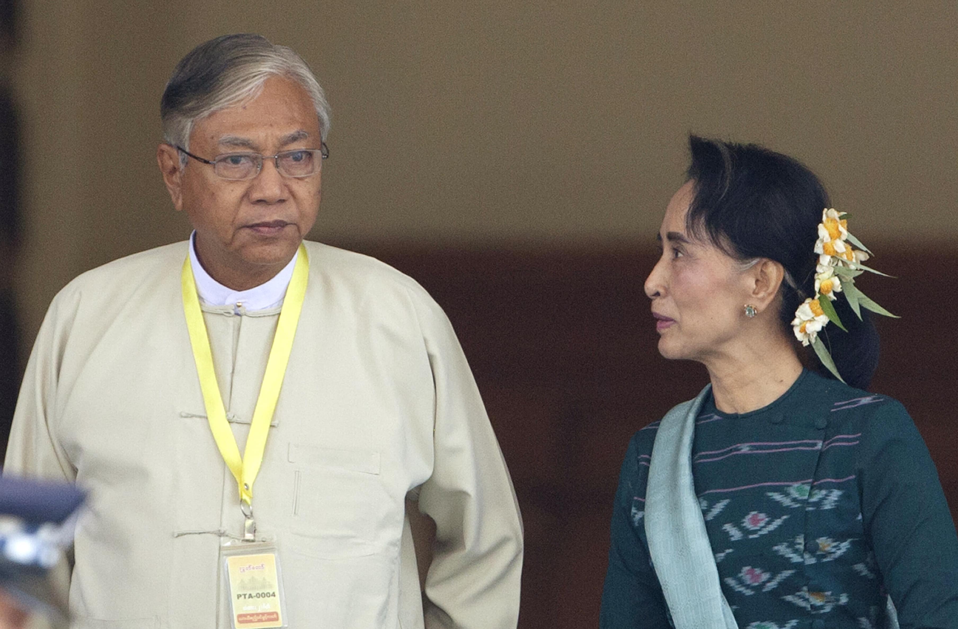Htin Kyaw, left, newly elected president of Myanmar, walks with National League for Democracy leader Aung San Suu Kyi, right, at Myanmar's parliament in Naypyitaw, Myanmar, March 15, 2016. , Aung Shine Oo, AP