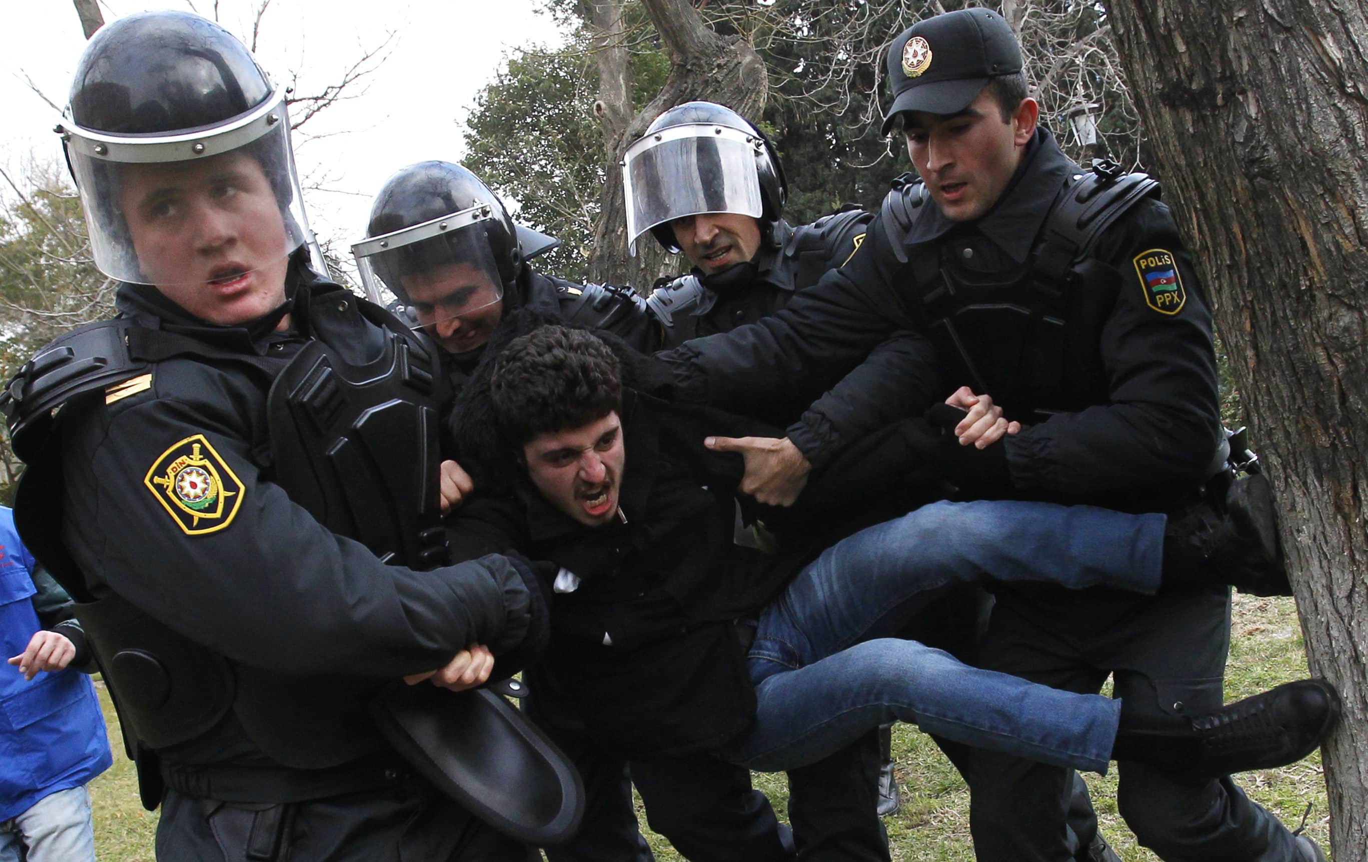 Policemen detain a man, who was protesting in solidarity with Ismailli residents after a riot, in Baku, 26 January 2013, REUTERS/David Mdzinarishvili