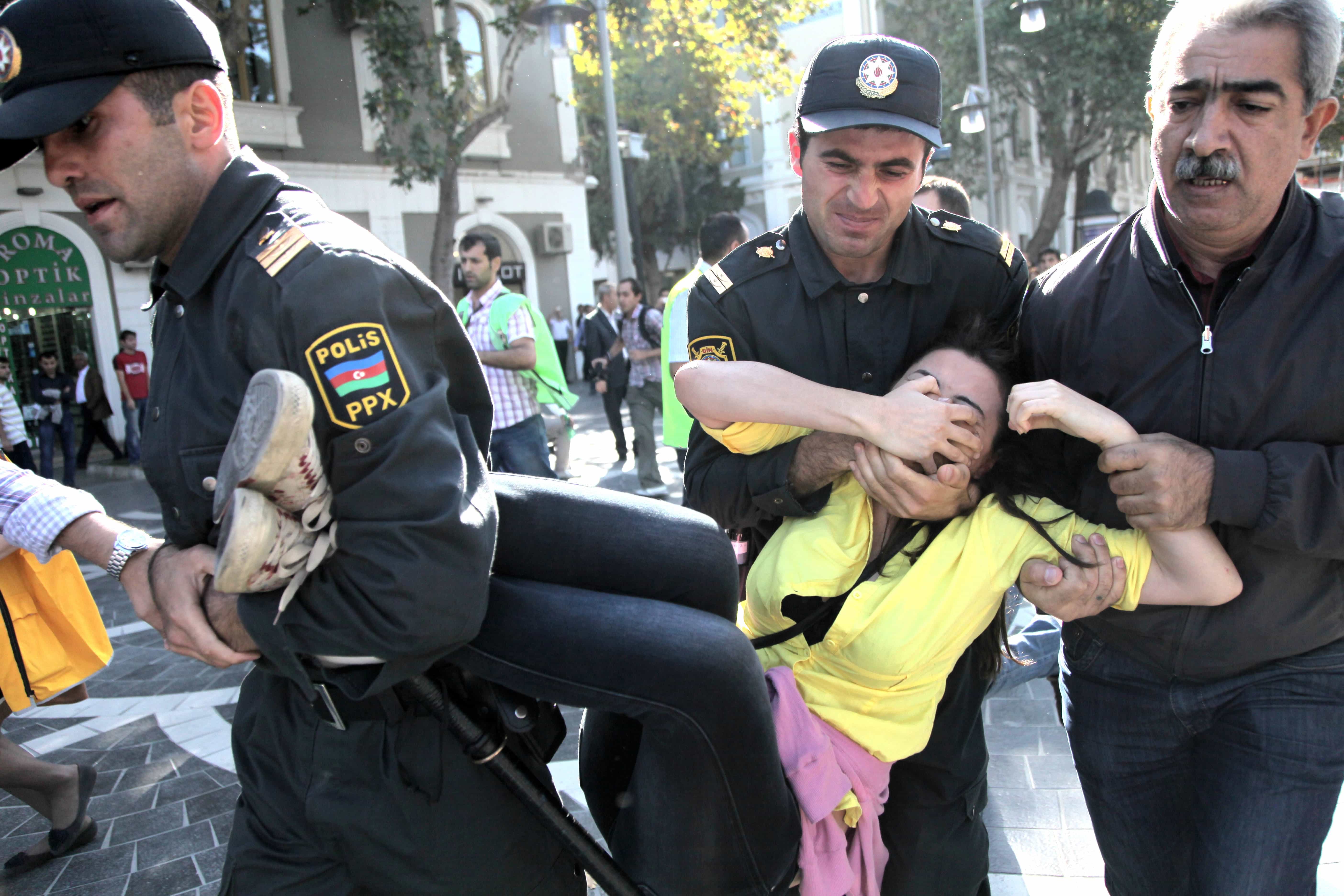 Police detain an opposition activist during an unsanctioned protest rally in Baku, Azerbaijan, 20 October 2012., AP Photo/Aziz Karimov