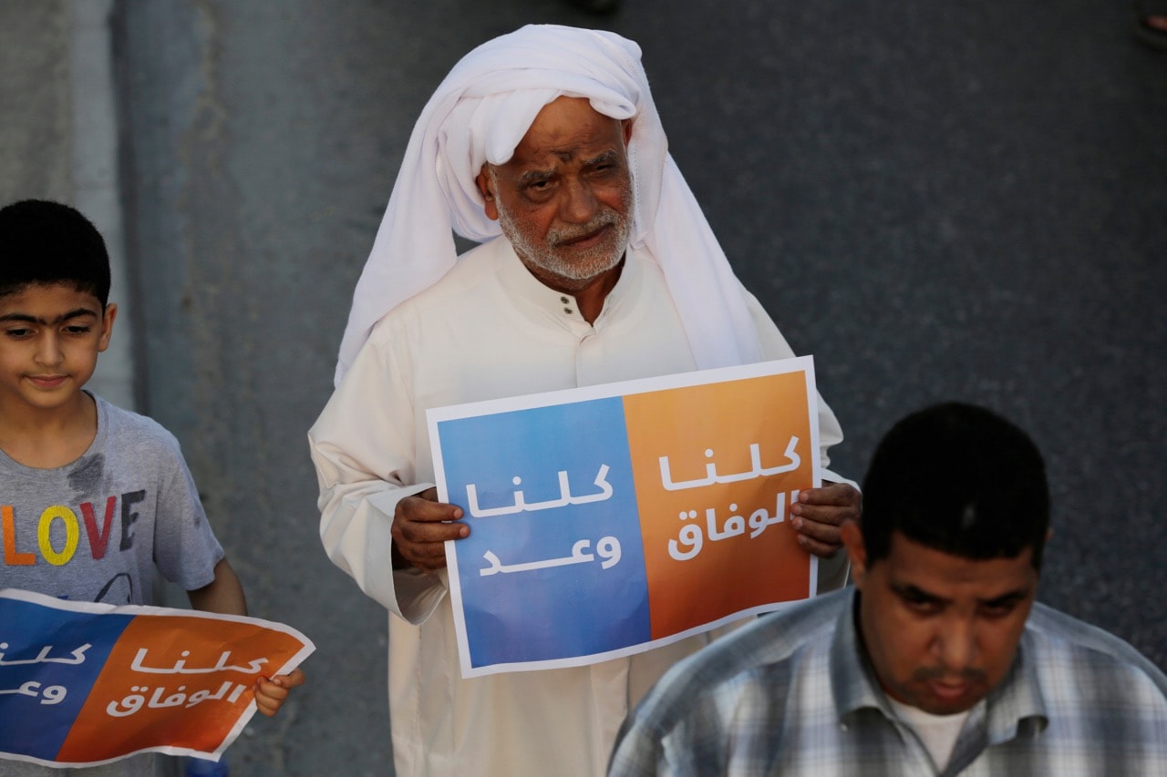 Bahraini anti-government protesters carry posters reading, "we are all Al-Wefaq, we are all Wa'ad," during a march in the northern village of Abu Saiba, Bahrain, 8 August 2014, AP Photo/Hasan Jamali