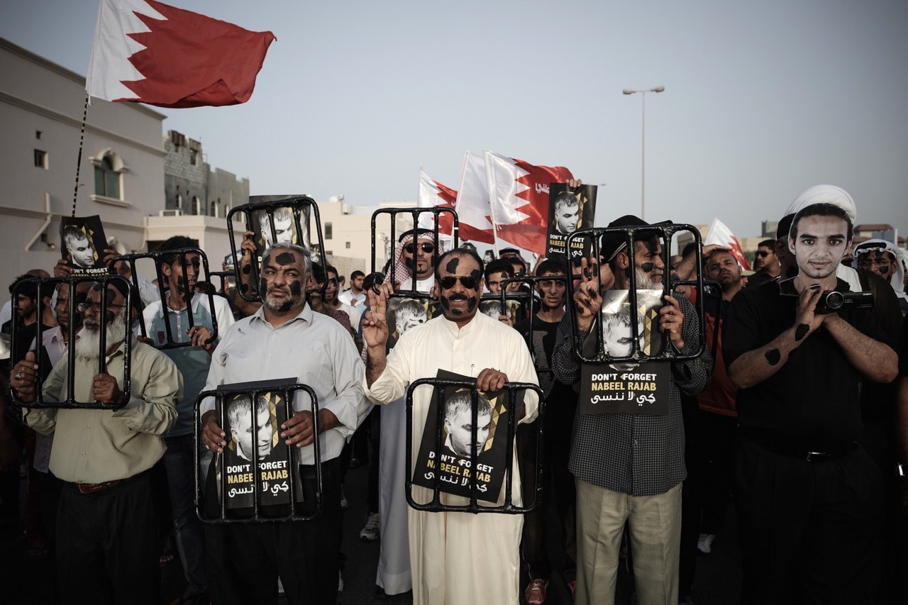 Bahraini protestors hold pictures of jailed human rights activist Nabeel Rajab during an anti-government rally in the village of A'ali, south of Manama, 27 June 2013, MOHAMMED AL-SHAIKH/AFP/Getty Images