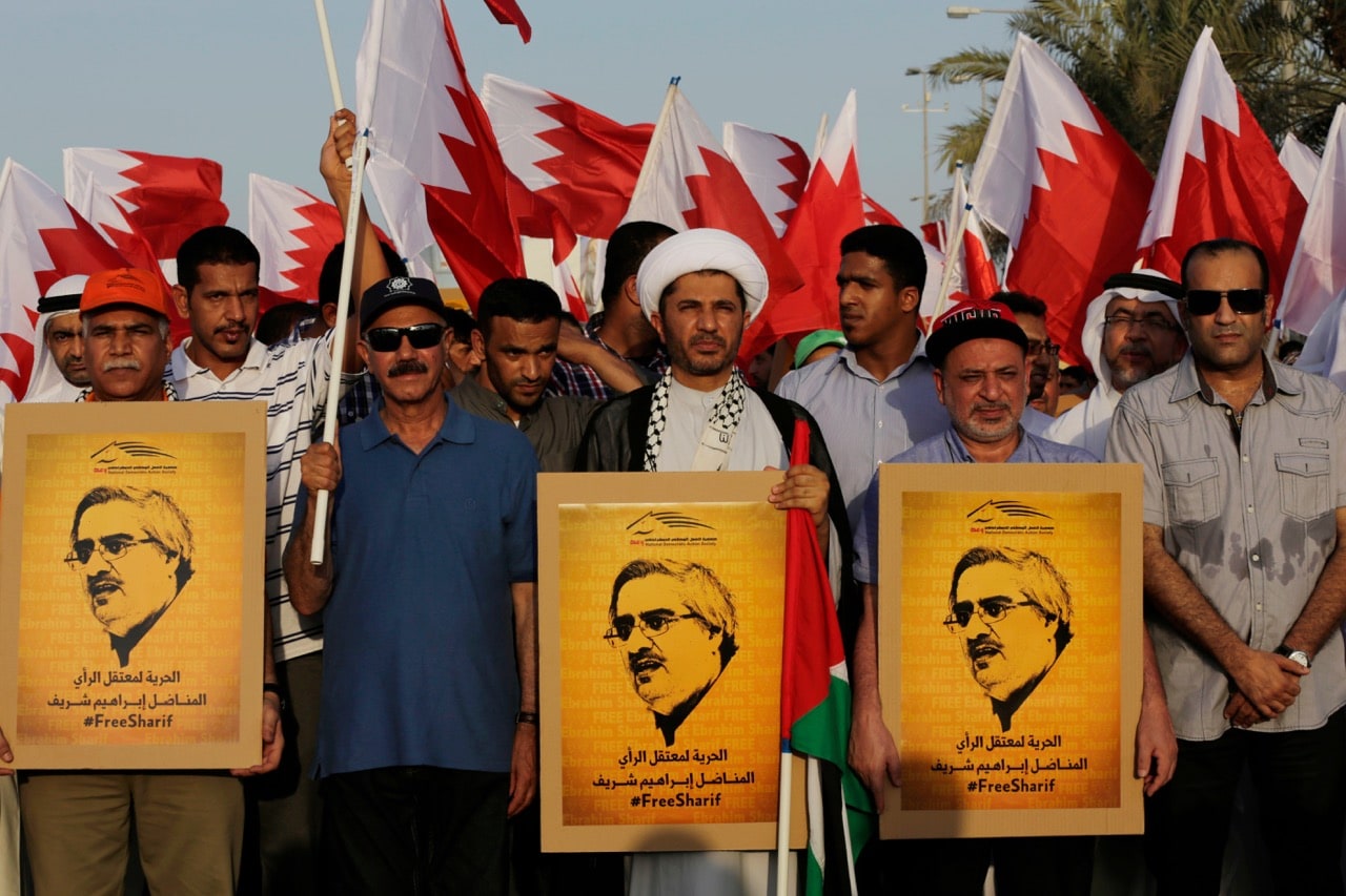 Bahraini anti-government protesters march in the northern village of Abu Saiba, Bahrain, 8 August 2014. The posters show jailed Wa'ad Society leader Ebrahim Sharif, calling for his freedom, AP Photo/Hasan Jamali