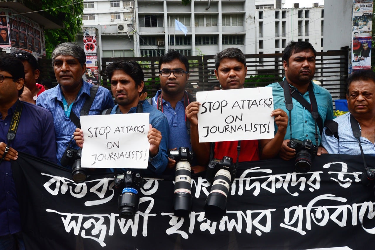 Bangladeshi photojournalists and journalists form a human chain in front of the National Press Club to protest the attacks on their colleagues during the coverage of student protests, in Dhaka, 7 August 2018, Mamunur RashidNurPhoto via Getty Images