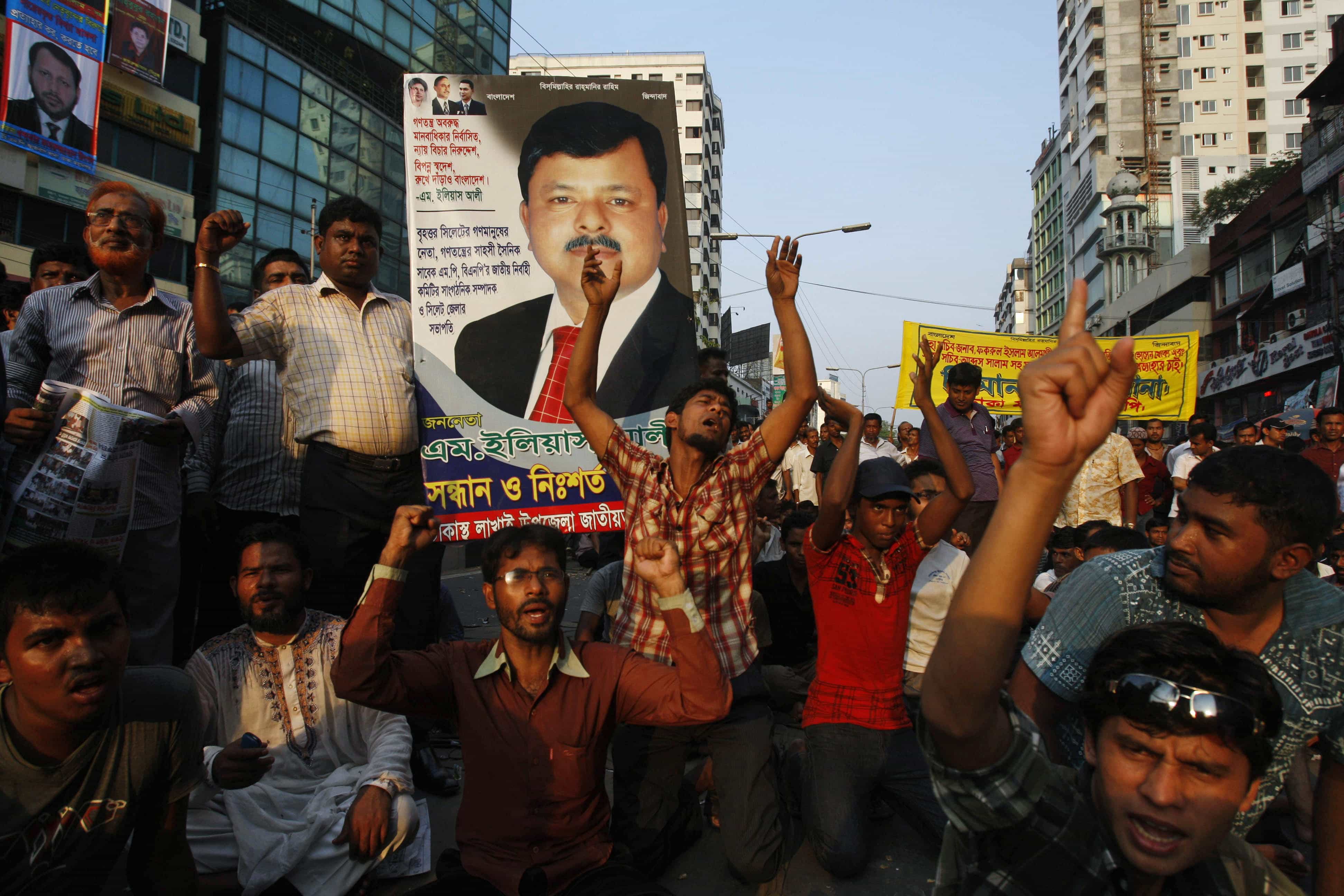 Opposition activists carry a portrait of Elias Ali, an opposition politician who was suspected to have been abducted by security forces in Dhaka, Bangladesh, 9 May 2012, AP Photo/Pavel Rahman