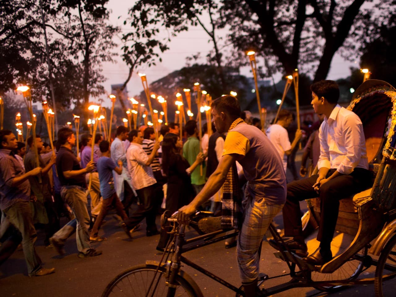 In this 6 November 2015 photo, demonstrators take part in a candlelight march in Dhaka, to demand justice for publishers and bloggers who were victims of attacks, AP Photo/Bernat Armangue