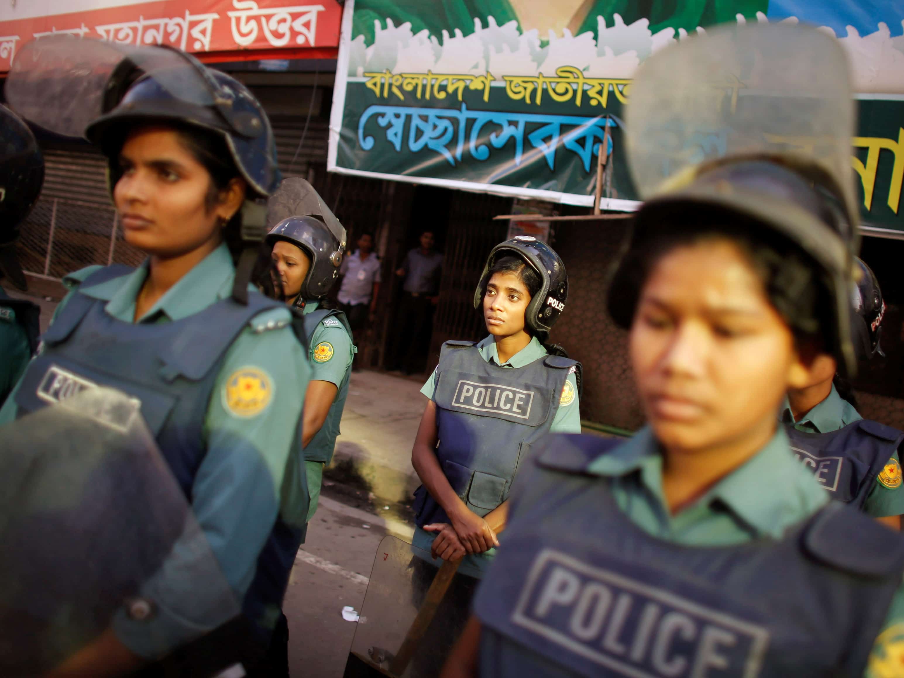 Police officers stand guard in front of the office of the Bangladesh Nationalist Party (BNP) during a strike in Dhaka, 28 October 2013, REUTERS/Andrew Biraj