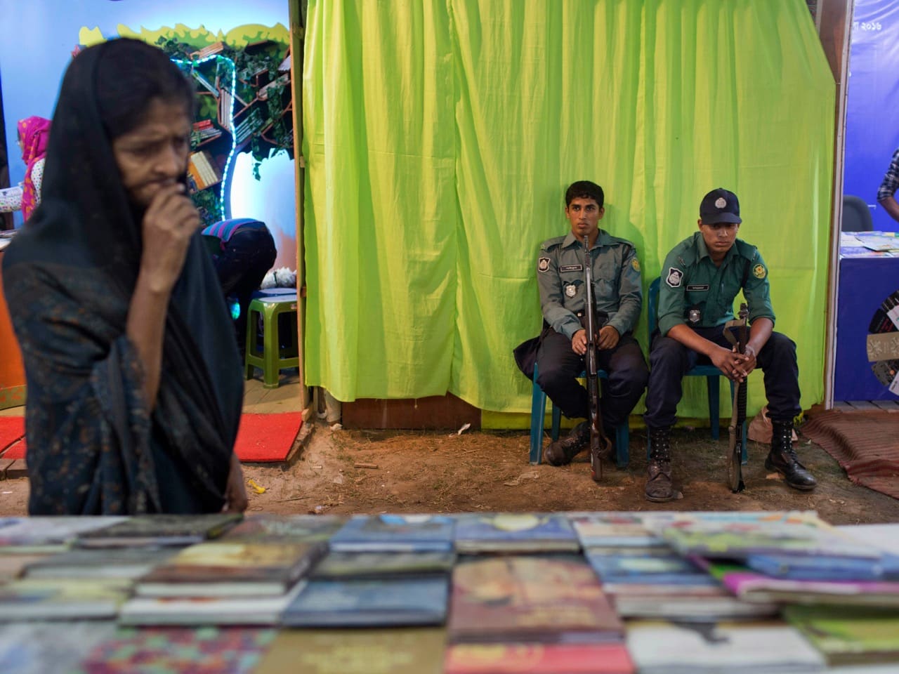 Policemen guard outside a shutdown stall of the Ba-Dwip Prakashan publishing house at the international book fair in Dhaka, 16 February 2016, AP Photo/ A.M. Ahad